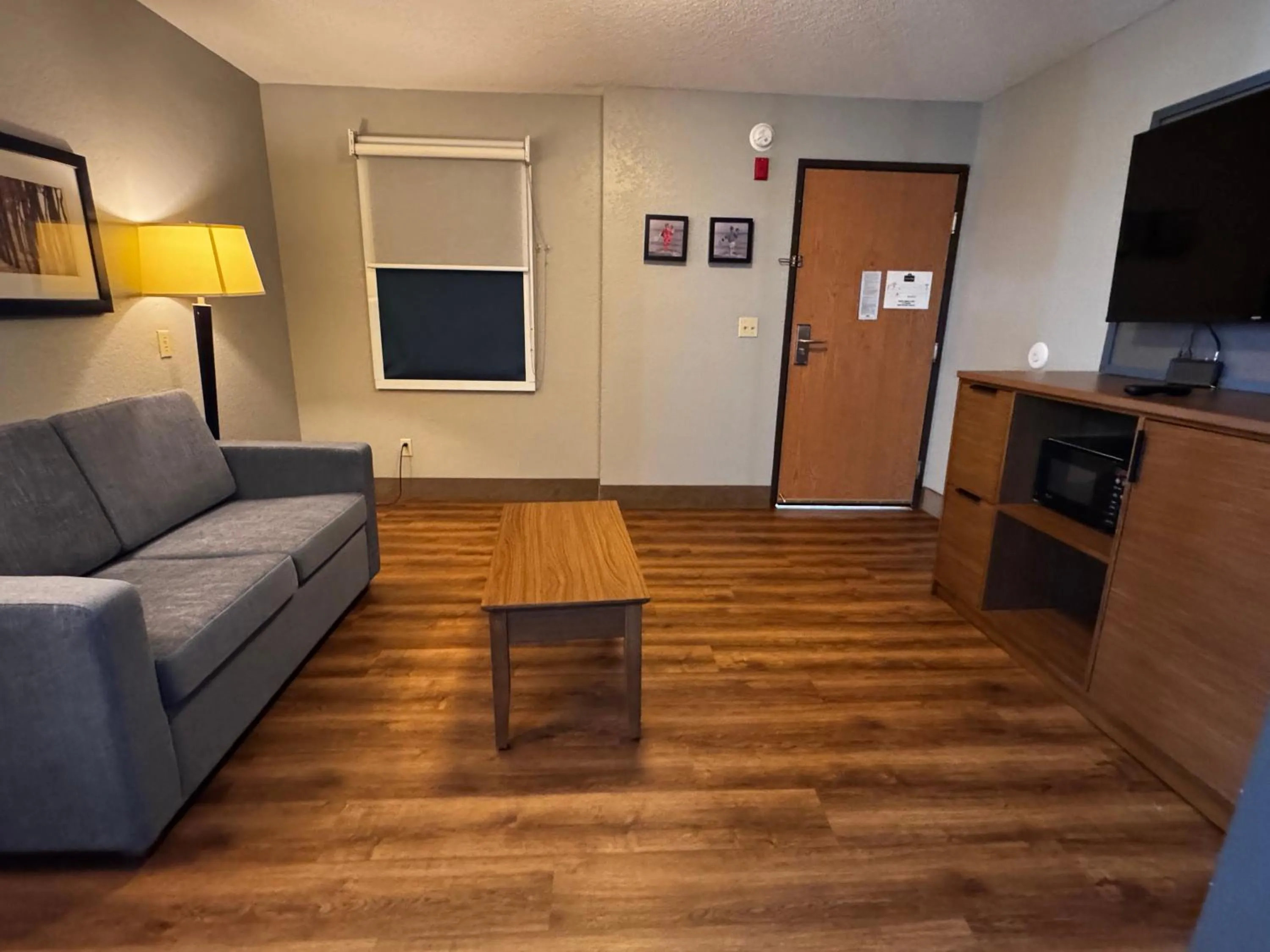 Living room in AmericInn by Wyndham White Bear Lake St. Paul