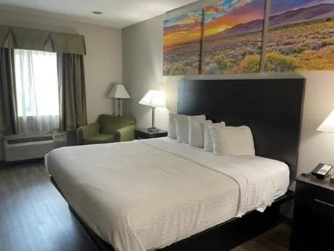Bed in Days Inn & Suites by Wyndham Dallas