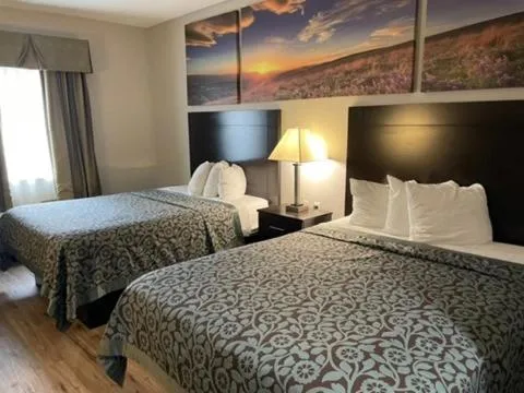 Bed in Days Inn & Suites by Wyndham Dallas