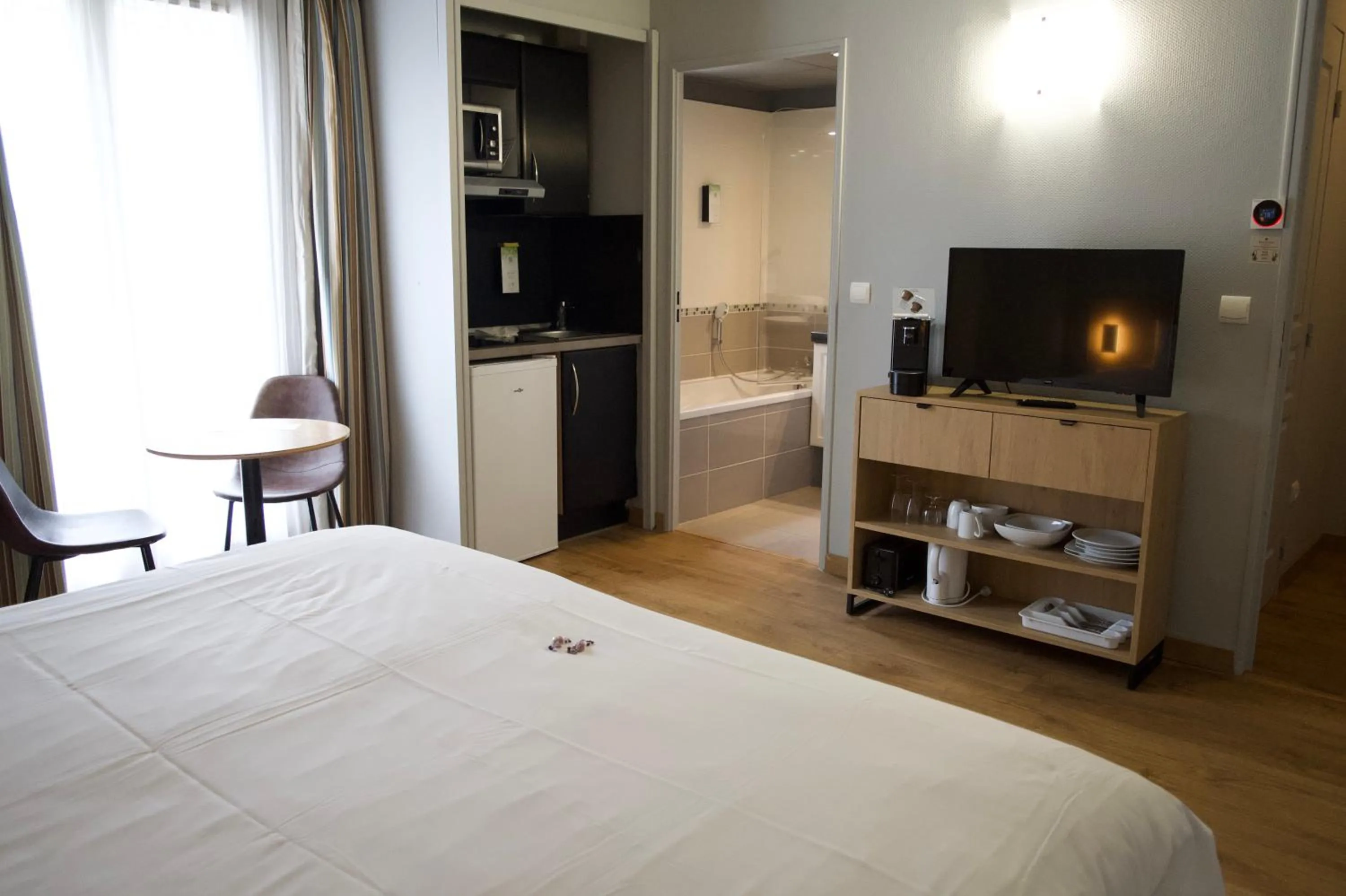 Bed in Tulip Inn Honfleur Residence & Spa