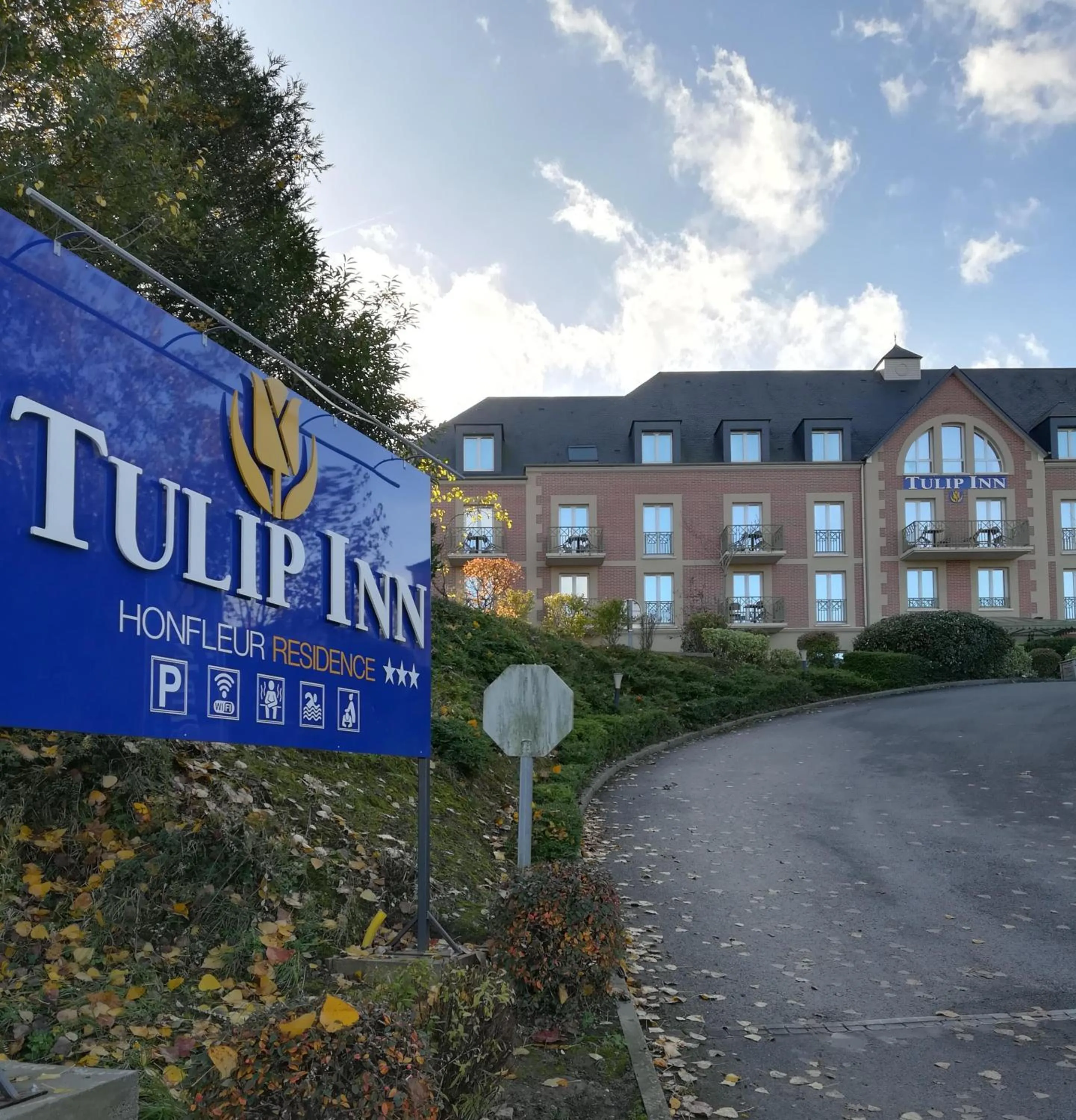 Property logo or sign in Tulip Inn Honfleur Residence & Spa