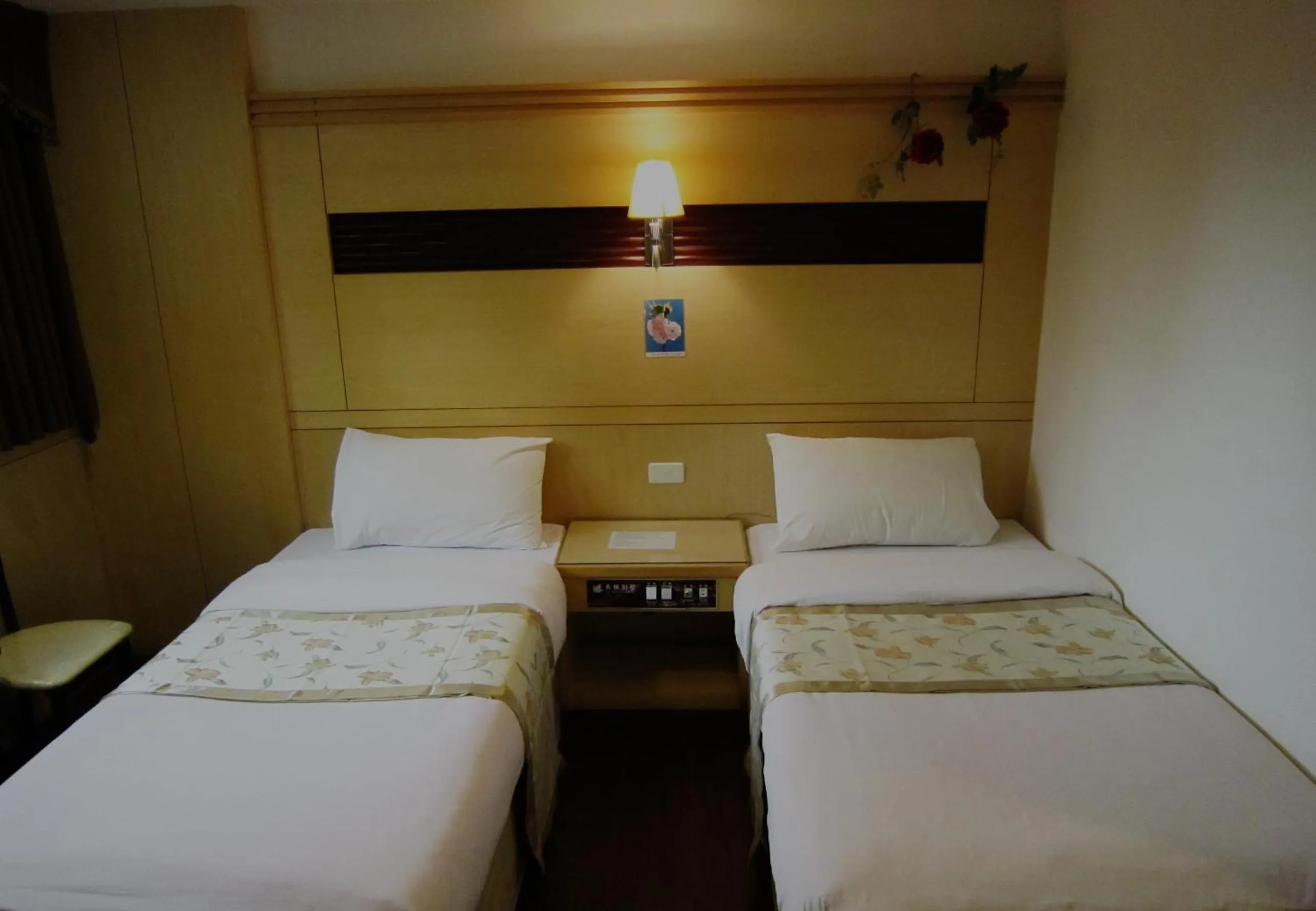 Bed in Gau Shan Ching Hotel
