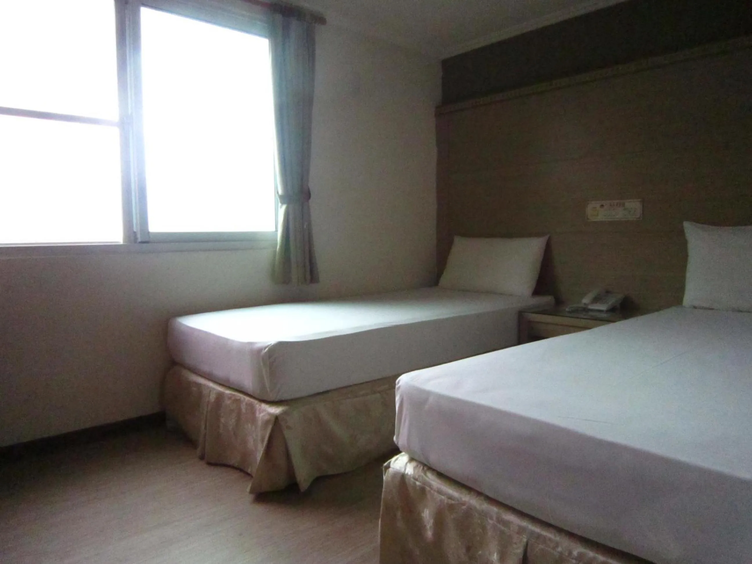 Bed in Gau Shan Ching Hotel