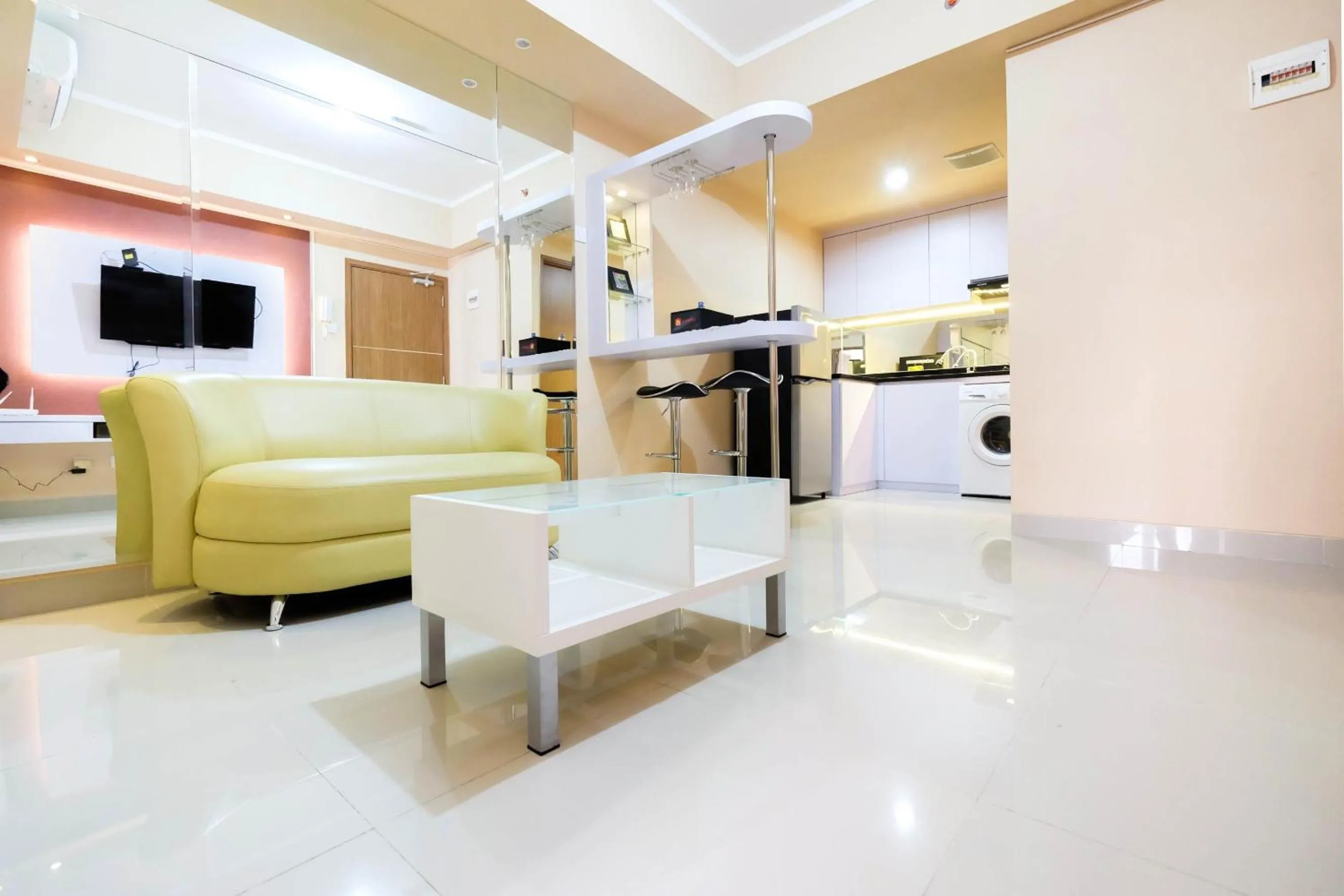 Bright and Stylish 1BR The Oasis Apartment Cikarang By Travelio