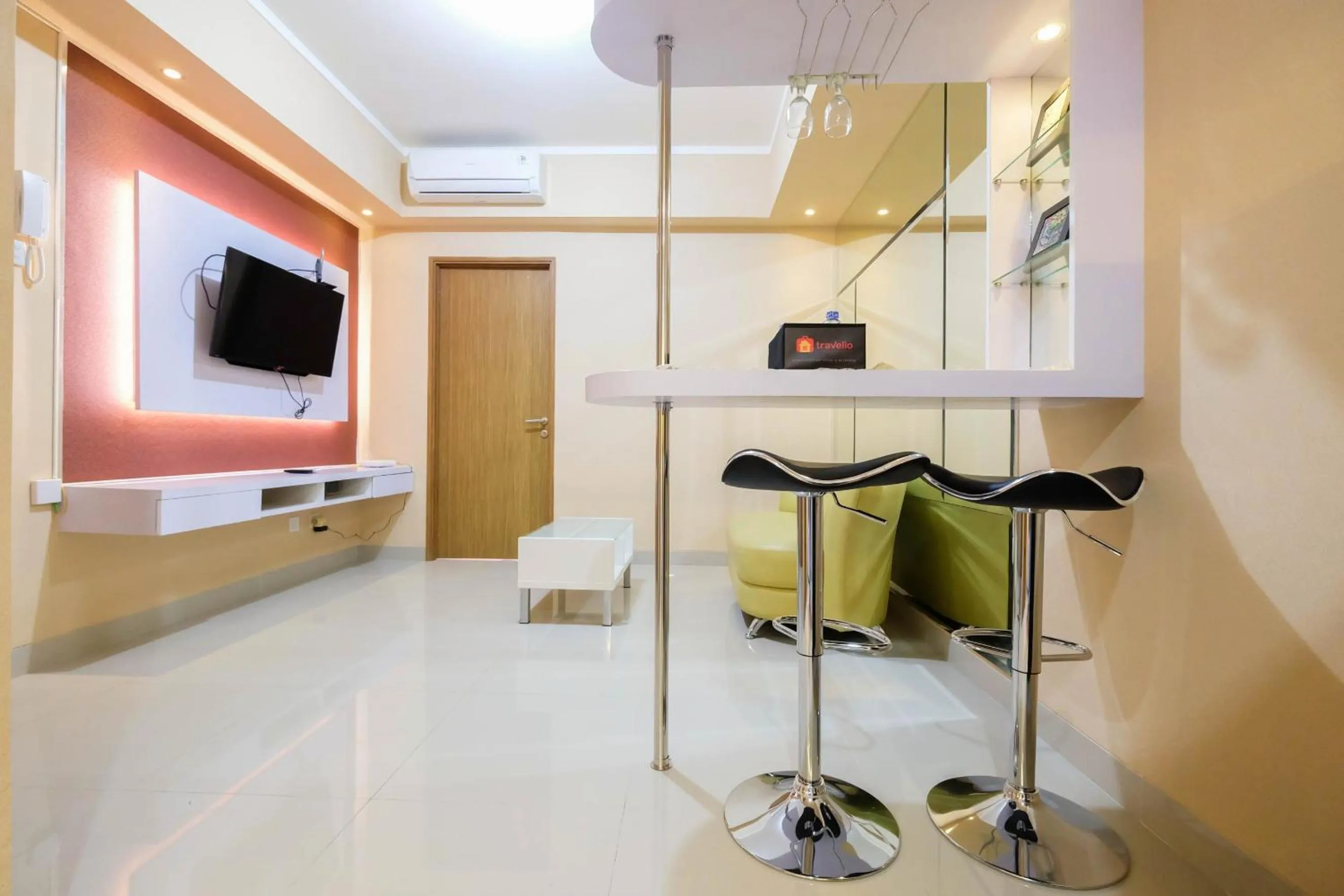 Bright and Stylish 1BR The Oasis Apartment Cikarang By Travelio