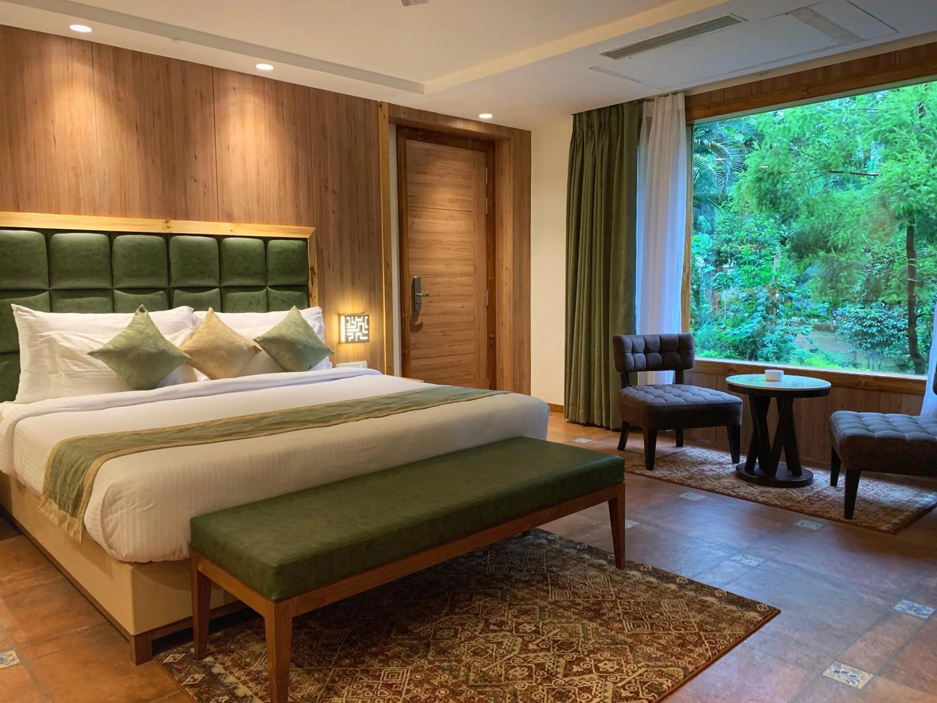 Bed in The Greenwood Resort, Guwahati