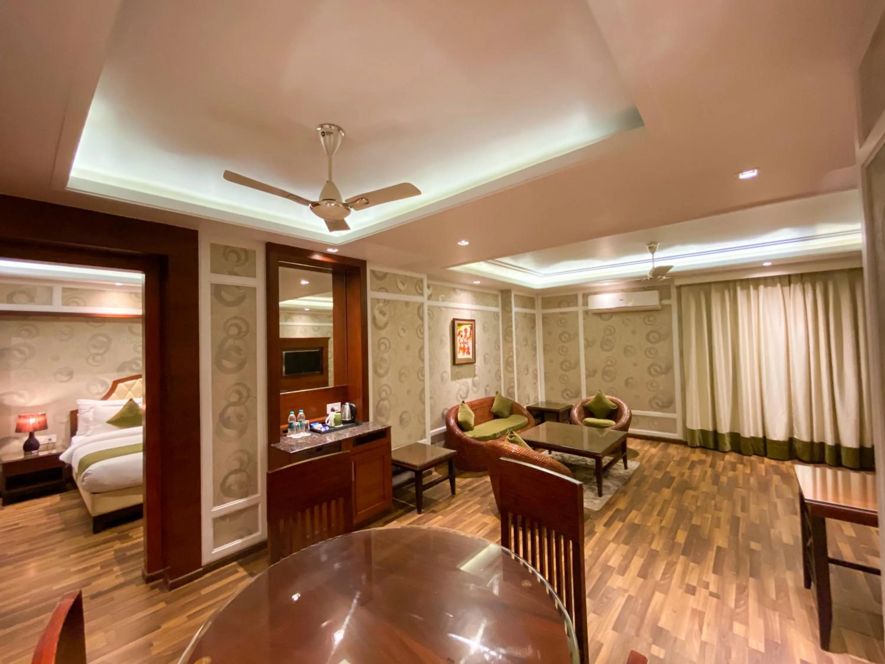 Seating area, Bed in The Greenwood Resort, Guwahati