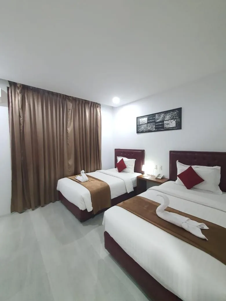 Bed in Grand Mahoni Hotel