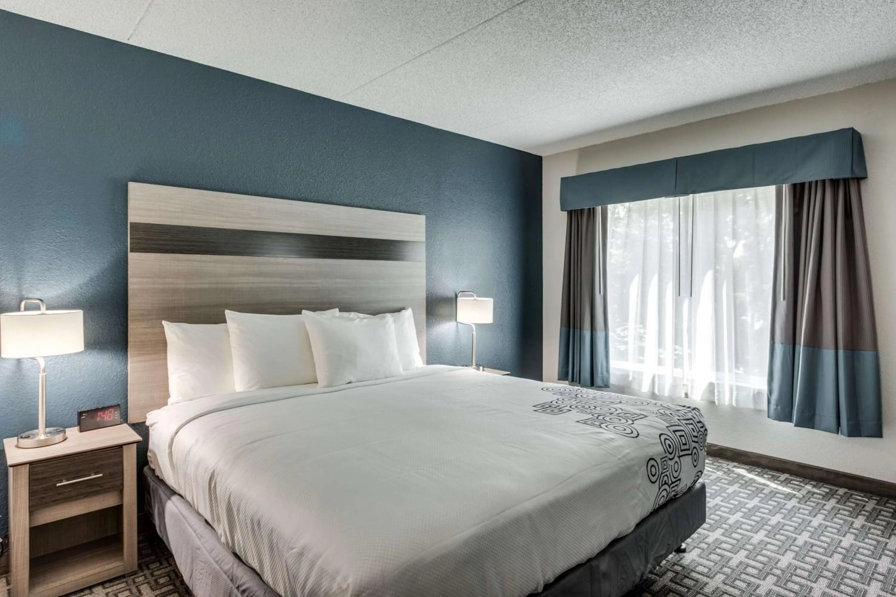 Bed in Days Inn & Suites by Wyndham Spokane