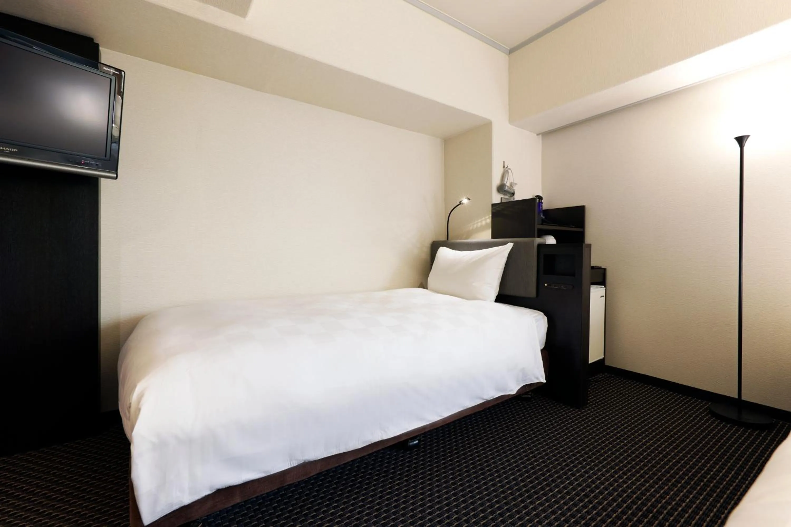 Bed in Hotel Consort Shin-Osaka