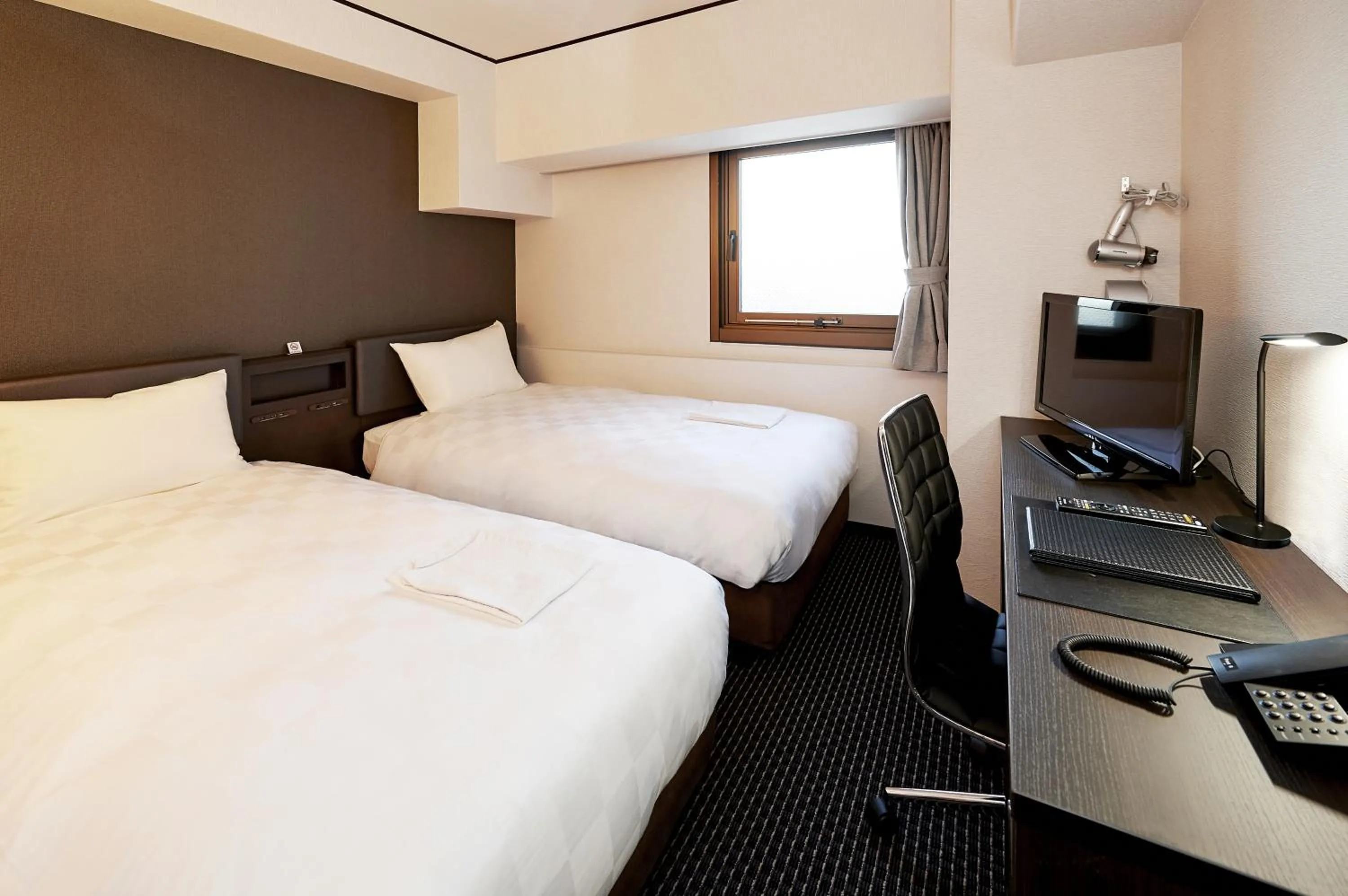 Photo of the whole room, Bed in Hotel Consort Shin-Osaka