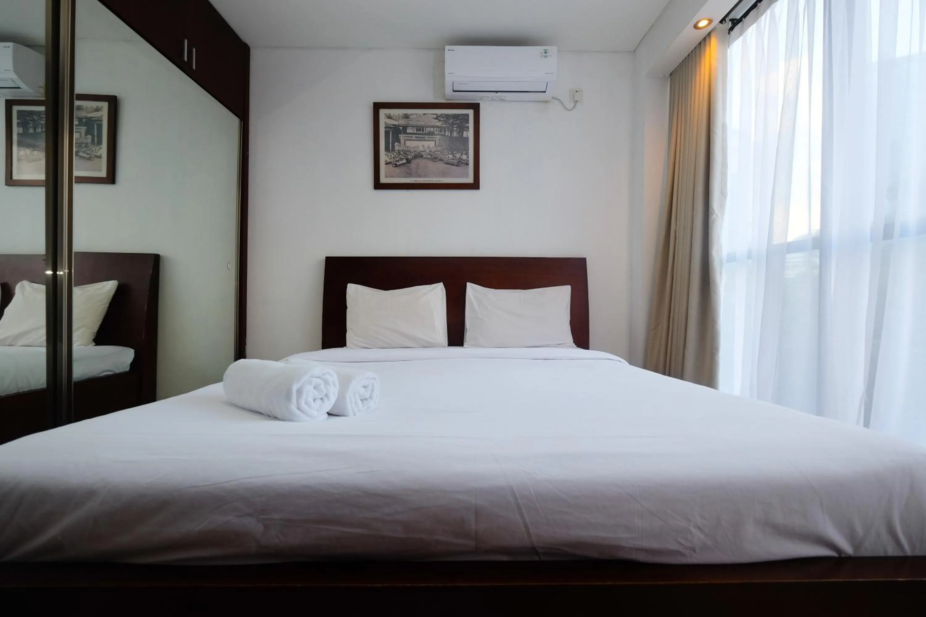 Bed in Best and Homey 2BR Taman Sari Semanggi Apartment By Travelio