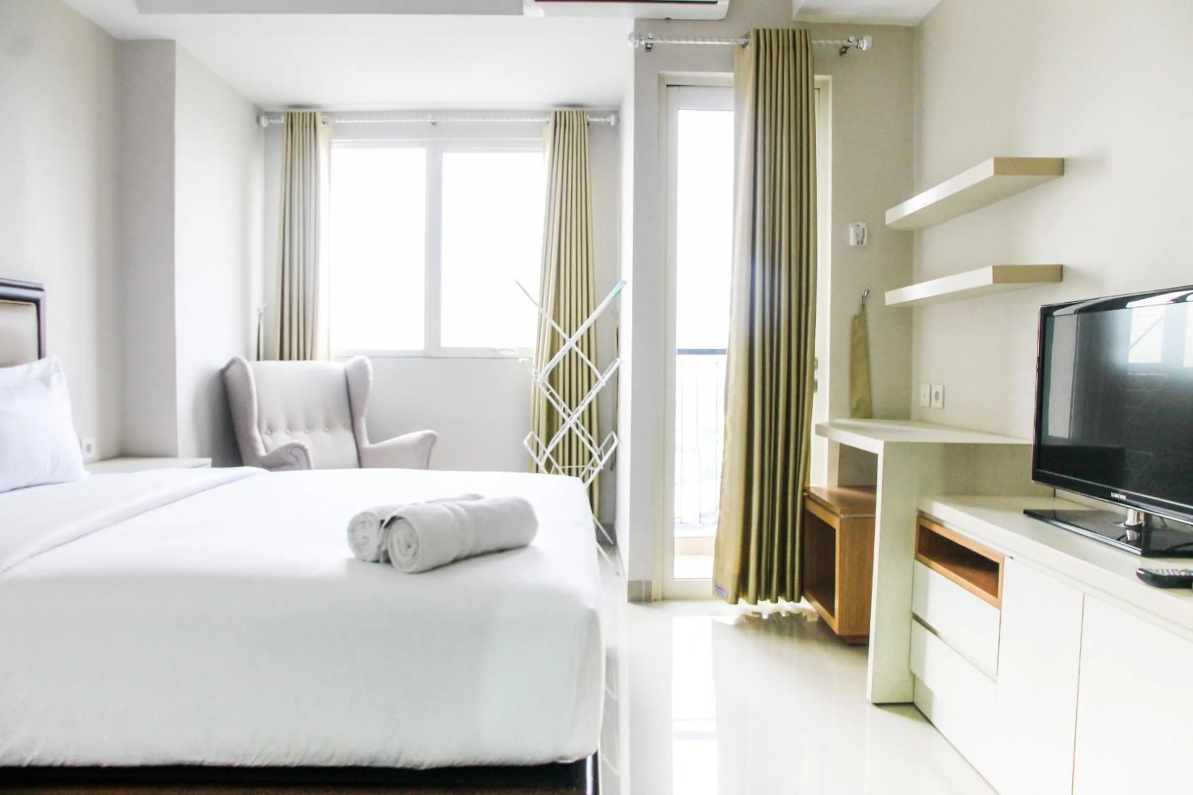 Bed in Best and Homey 2BR Taman Sari Semanggi Apartment By Travelio