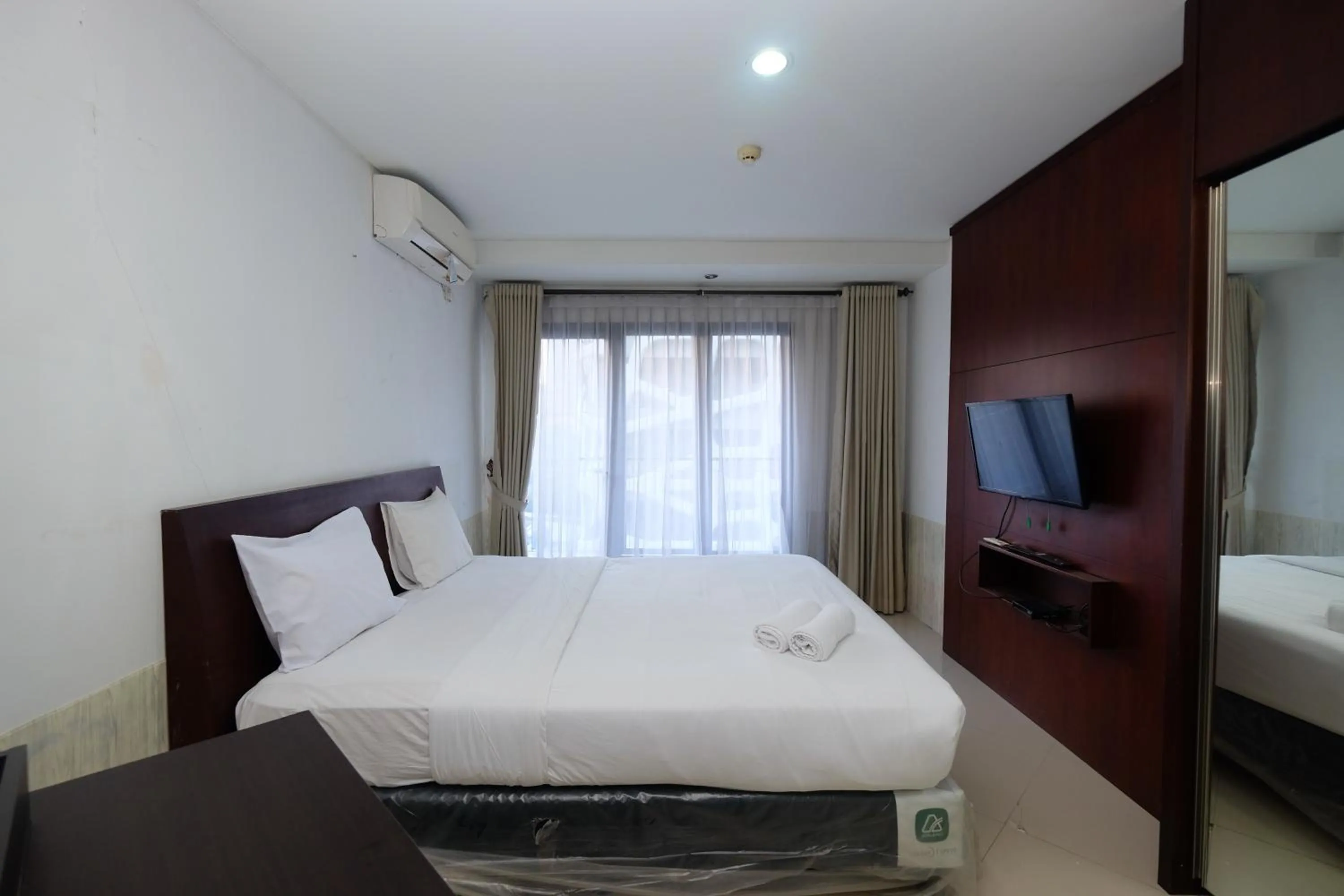 Bed in Best and Homey 2BR Taman Sari Semanggi Apartment By Travelio