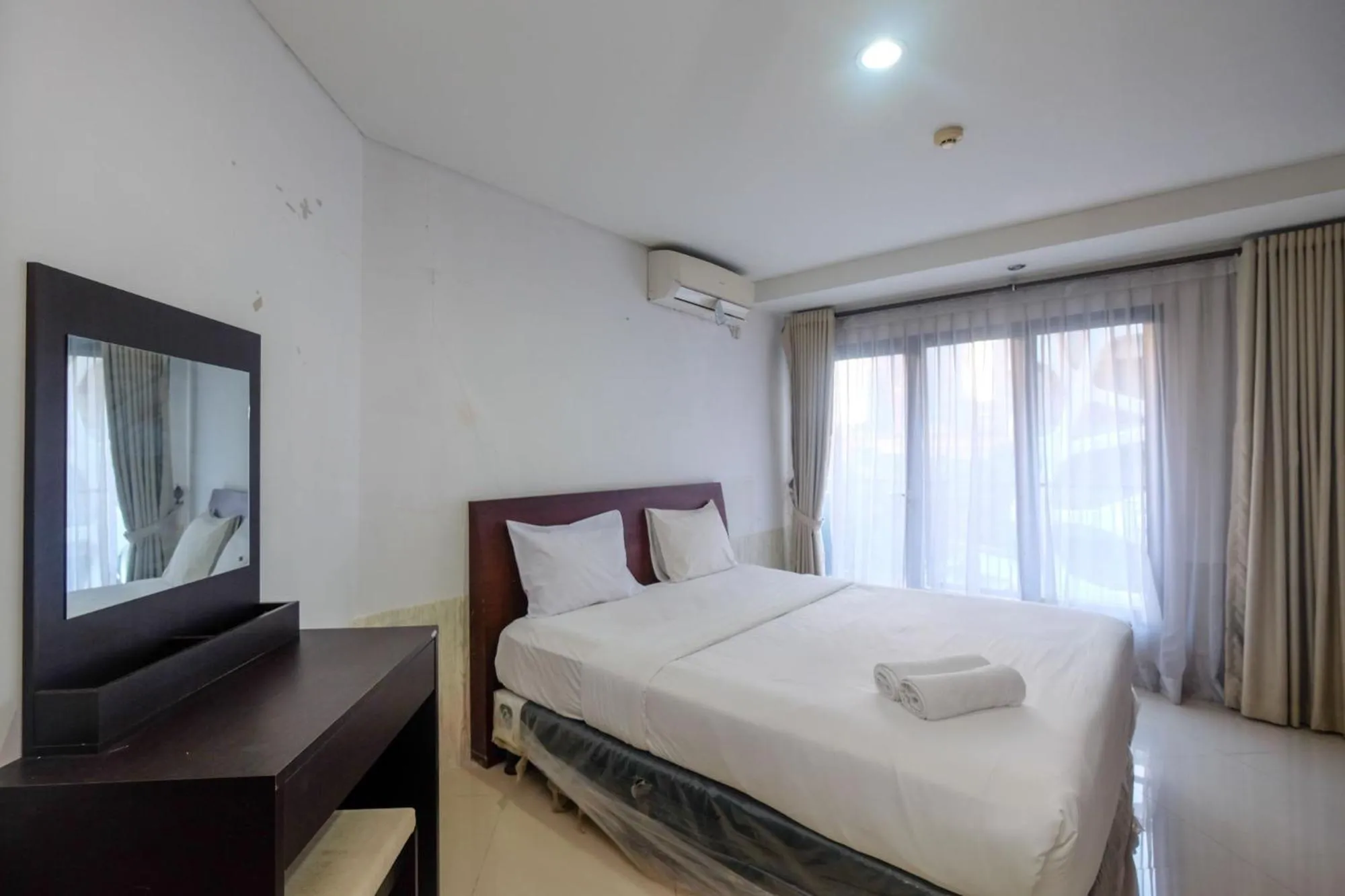 Bed in Best and Homey 2BR Taman Sari Semanggi Apartment By Travelio