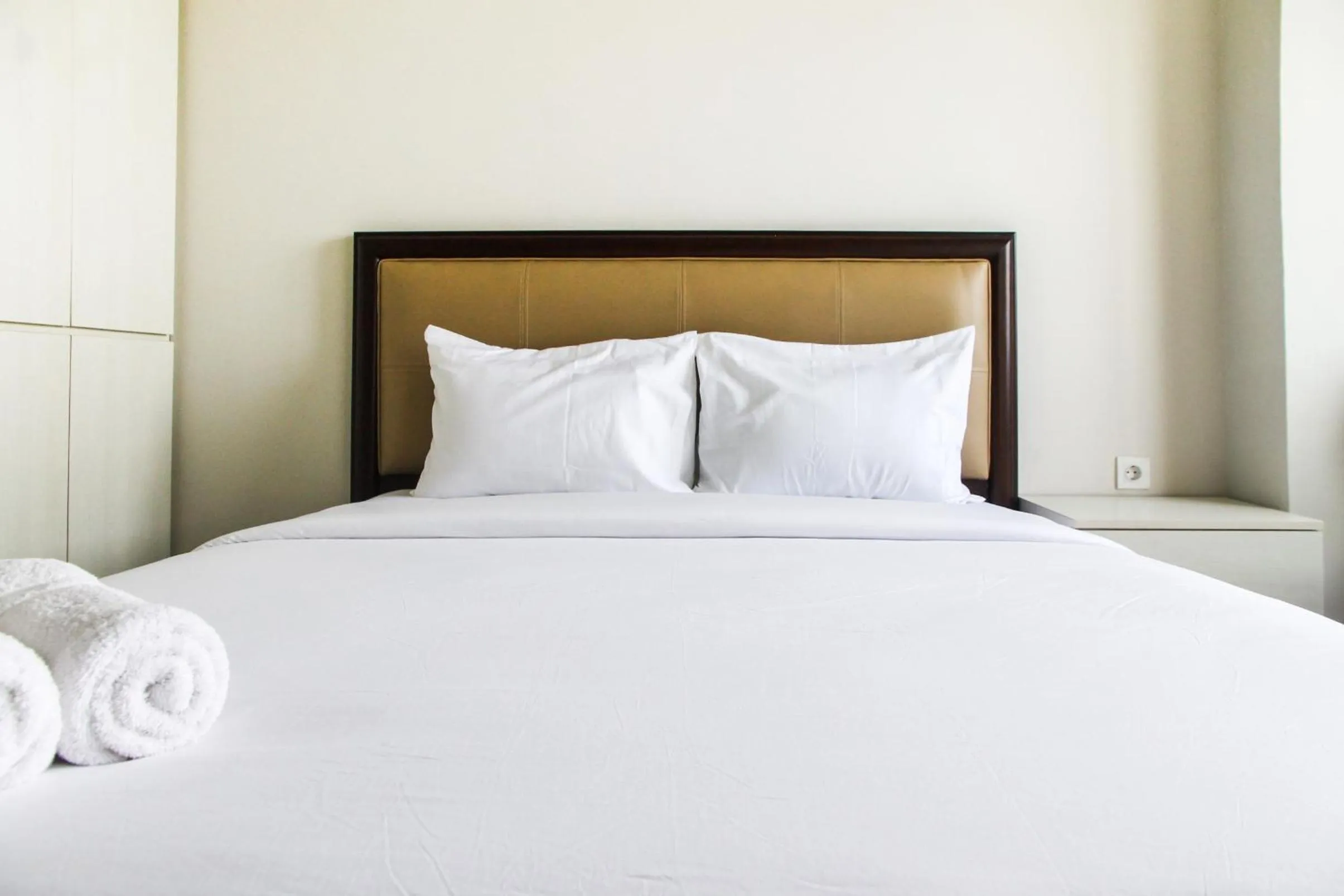 Bed in Best and Homey 2BR Taman Sari Semanggi Apartment By Travelio