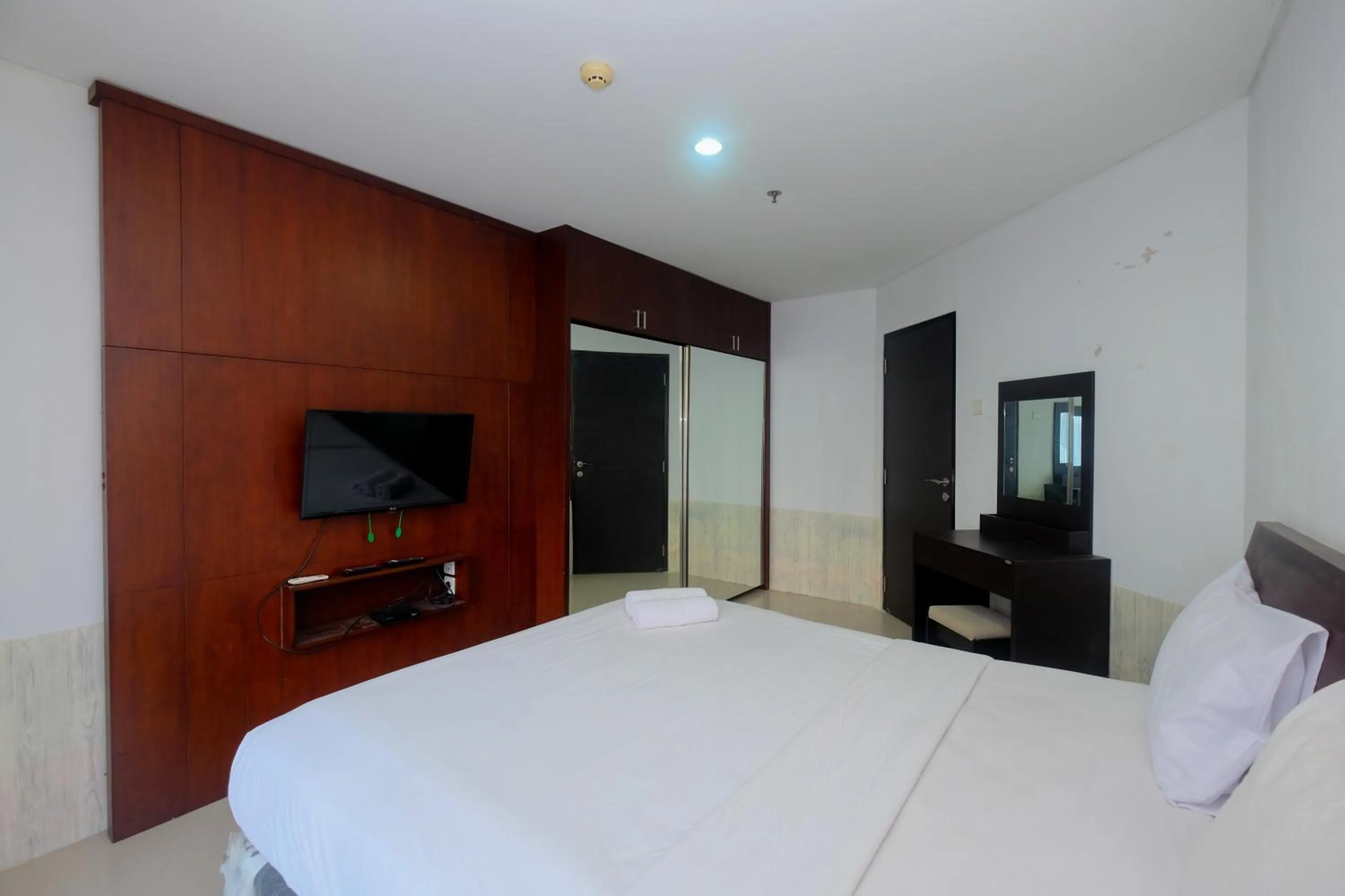 Bed in Best and Homey 2BR Taman Sari Semanggi Apartment By Travelio