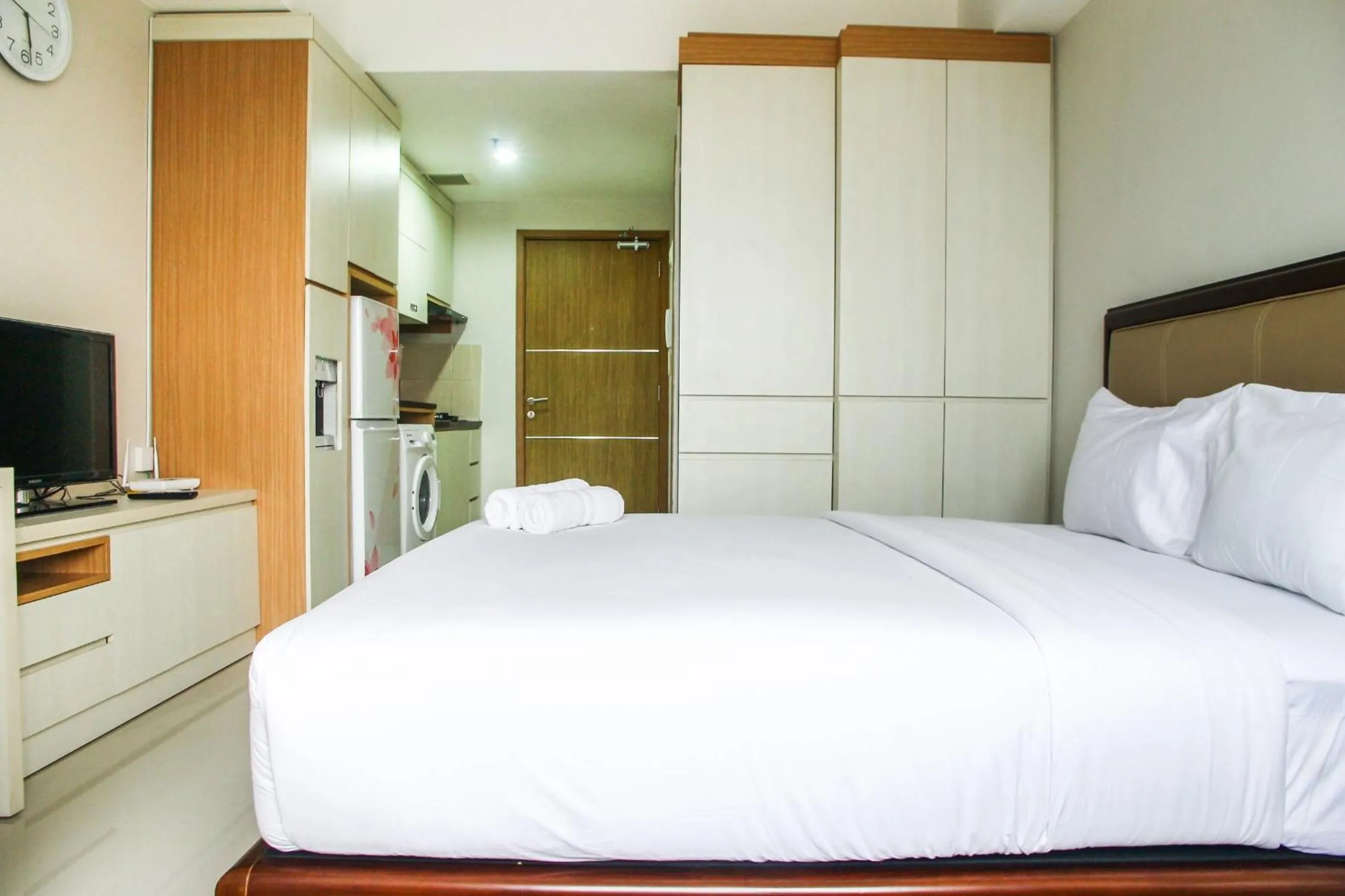 Bed in Best and Homey 2BR Taman Sari Semanggi Apartment By Travelio