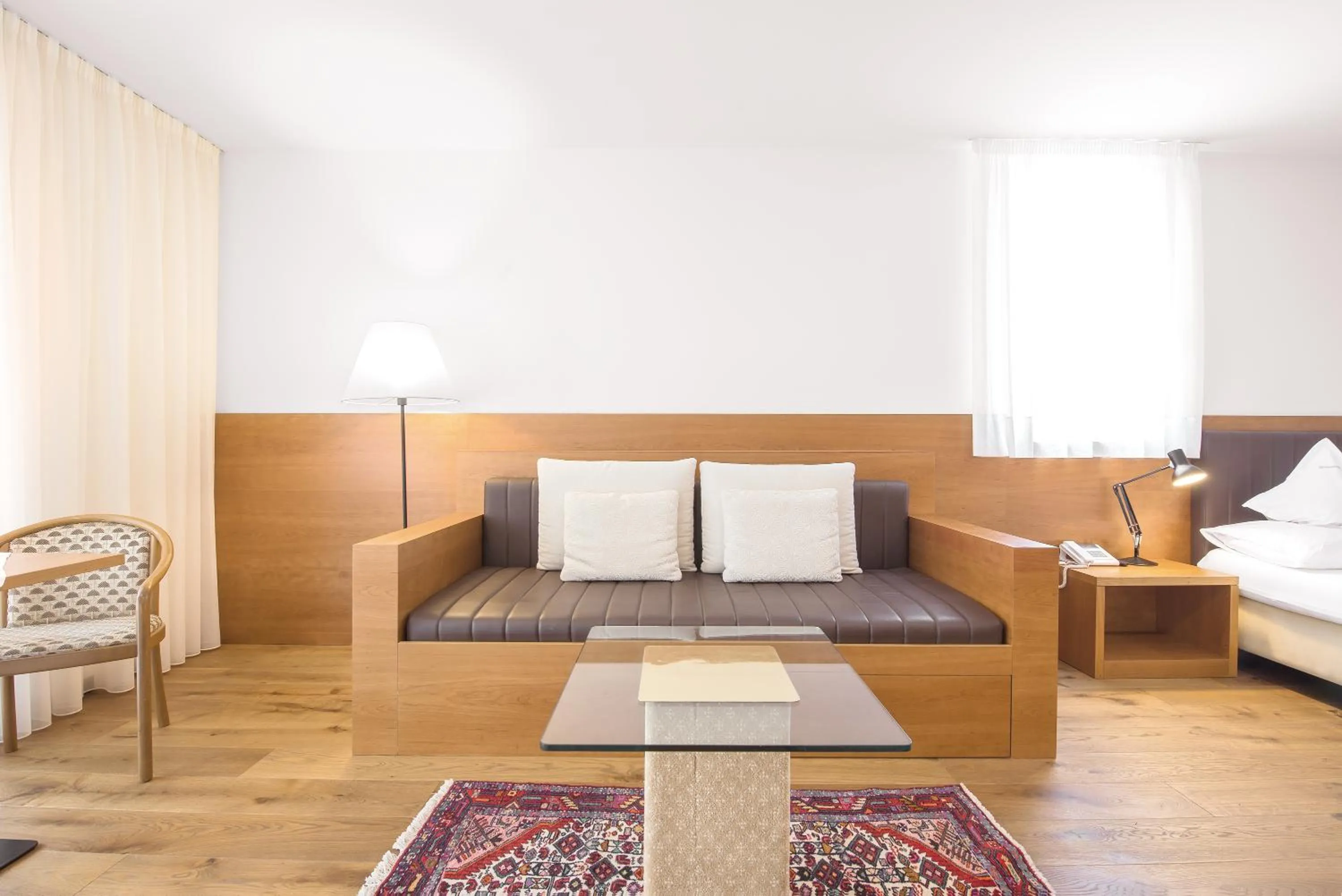 Living room, Bed in Hotel Sonnenhof