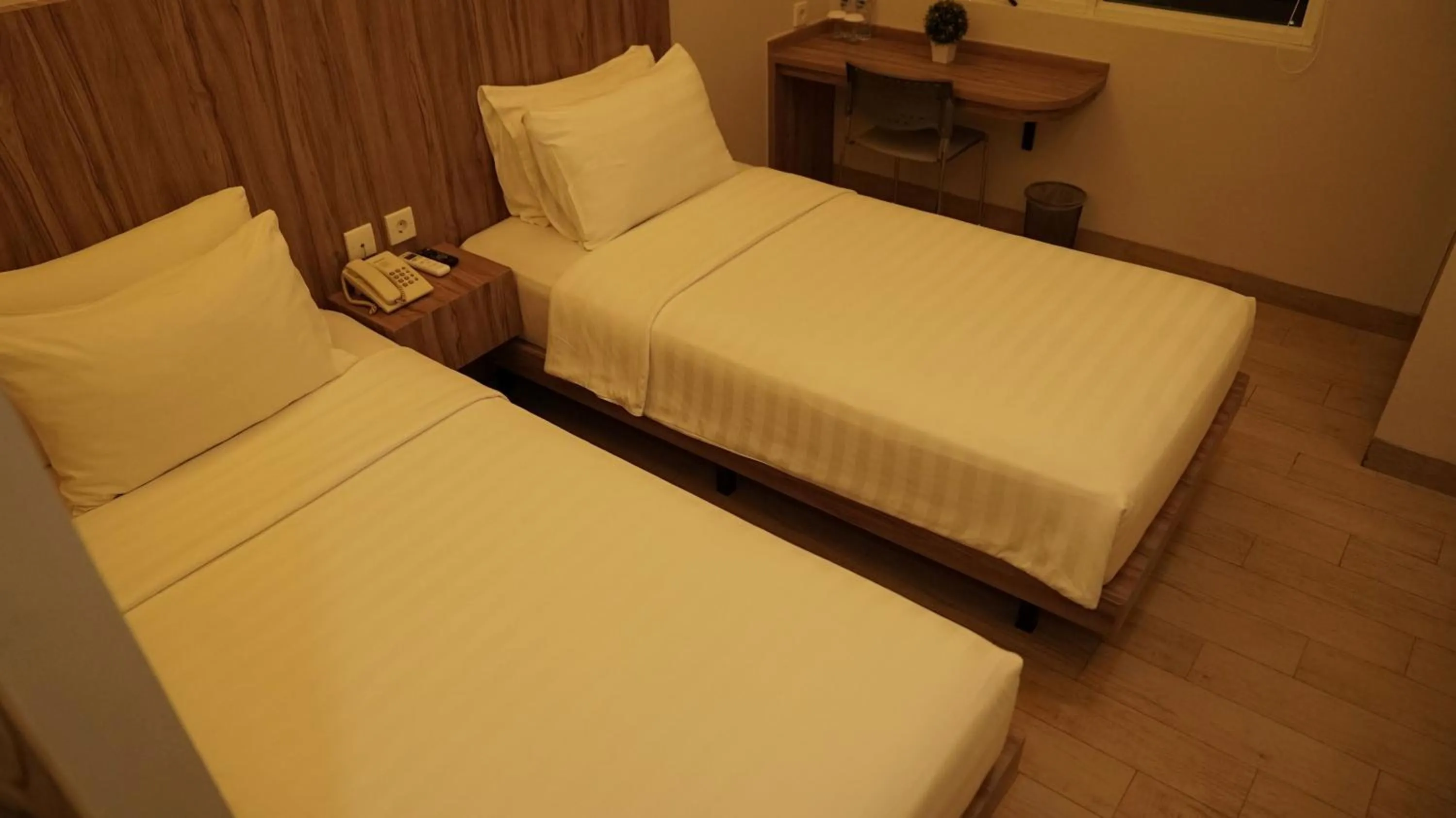 Bed in Hotel Cikini