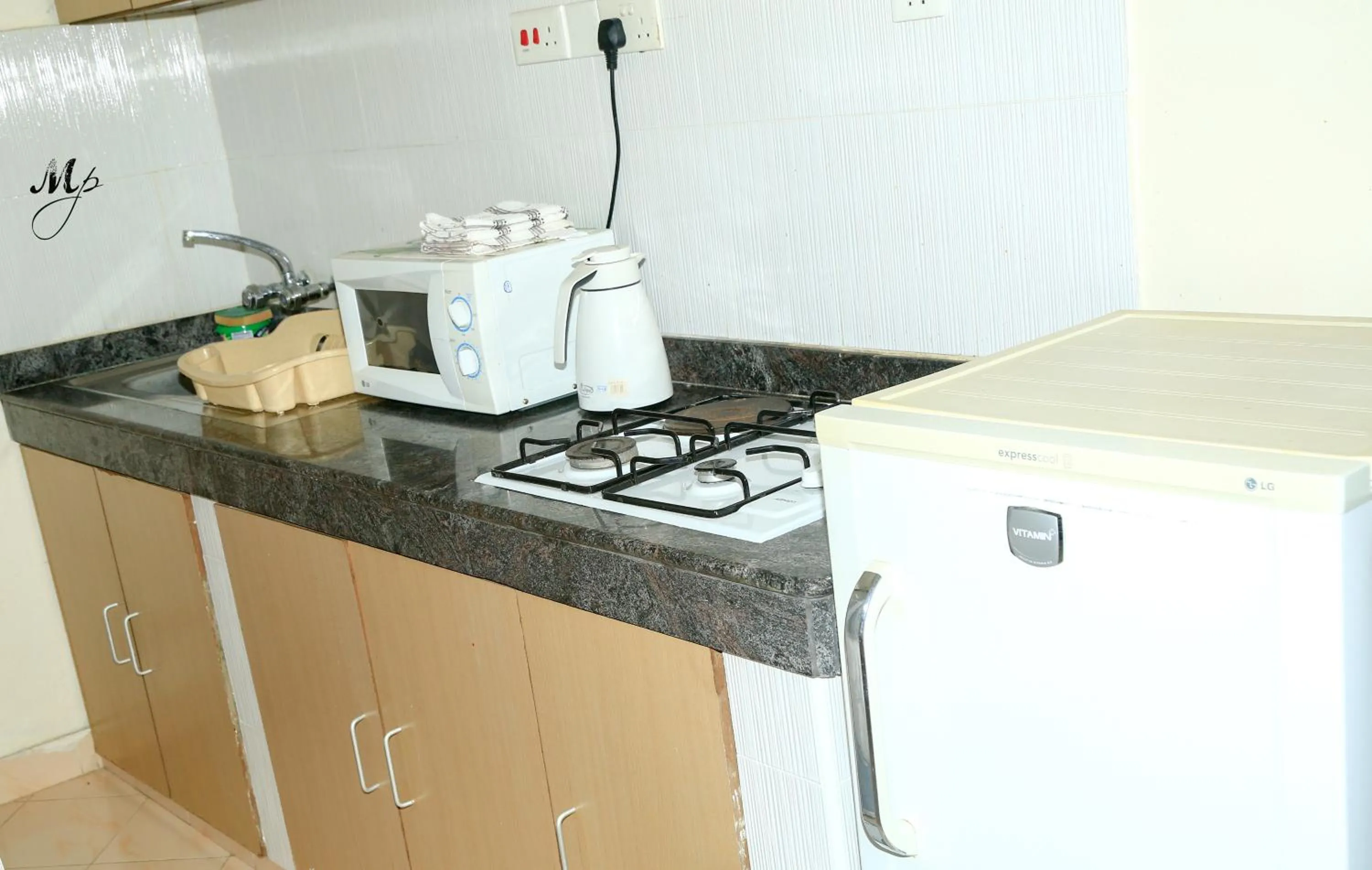 Kitchen or kitchenette in Mei Place Apartments