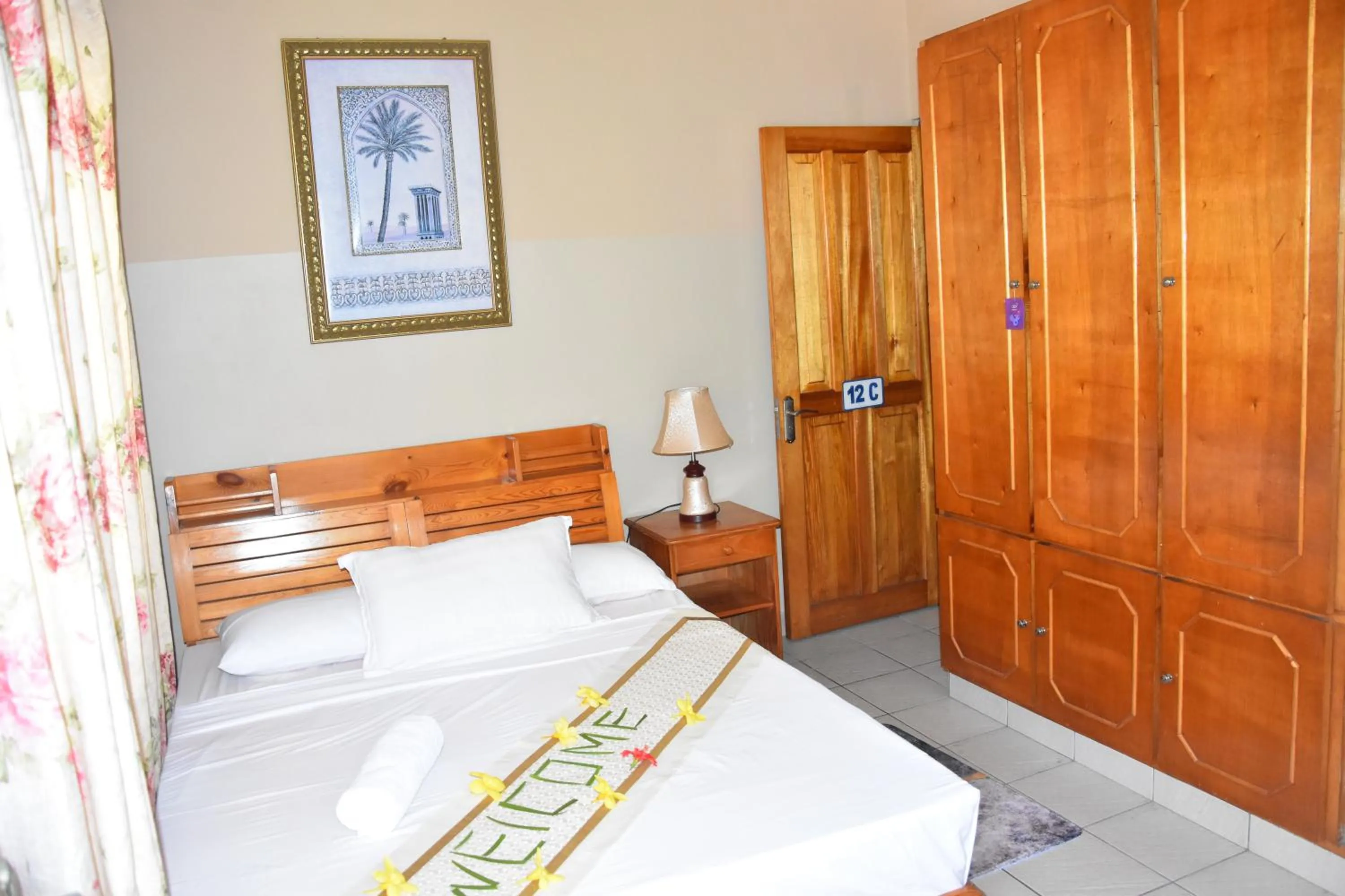 Bed in Reef Holiday Apartments