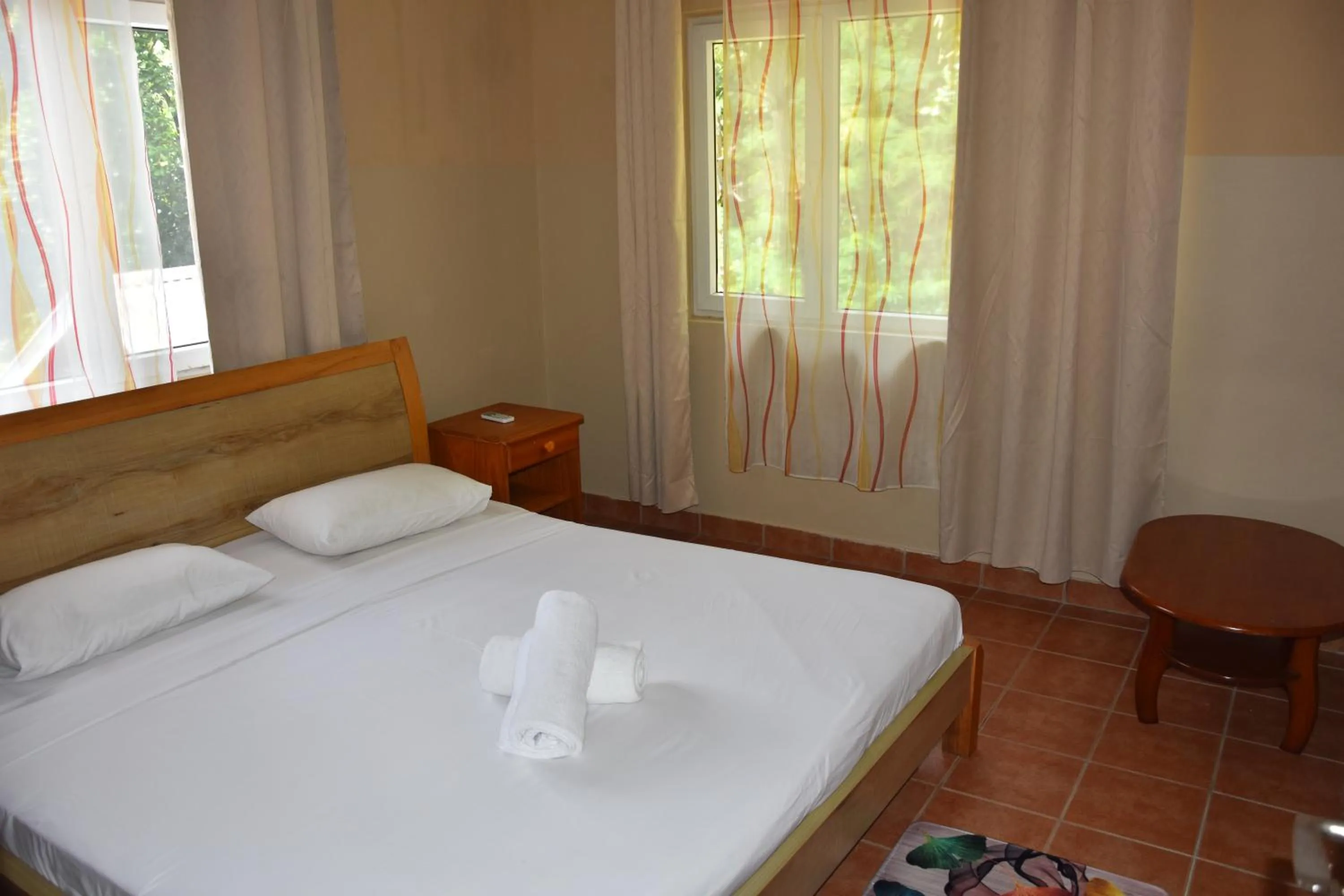 Bed in Reef Holiday Apartments