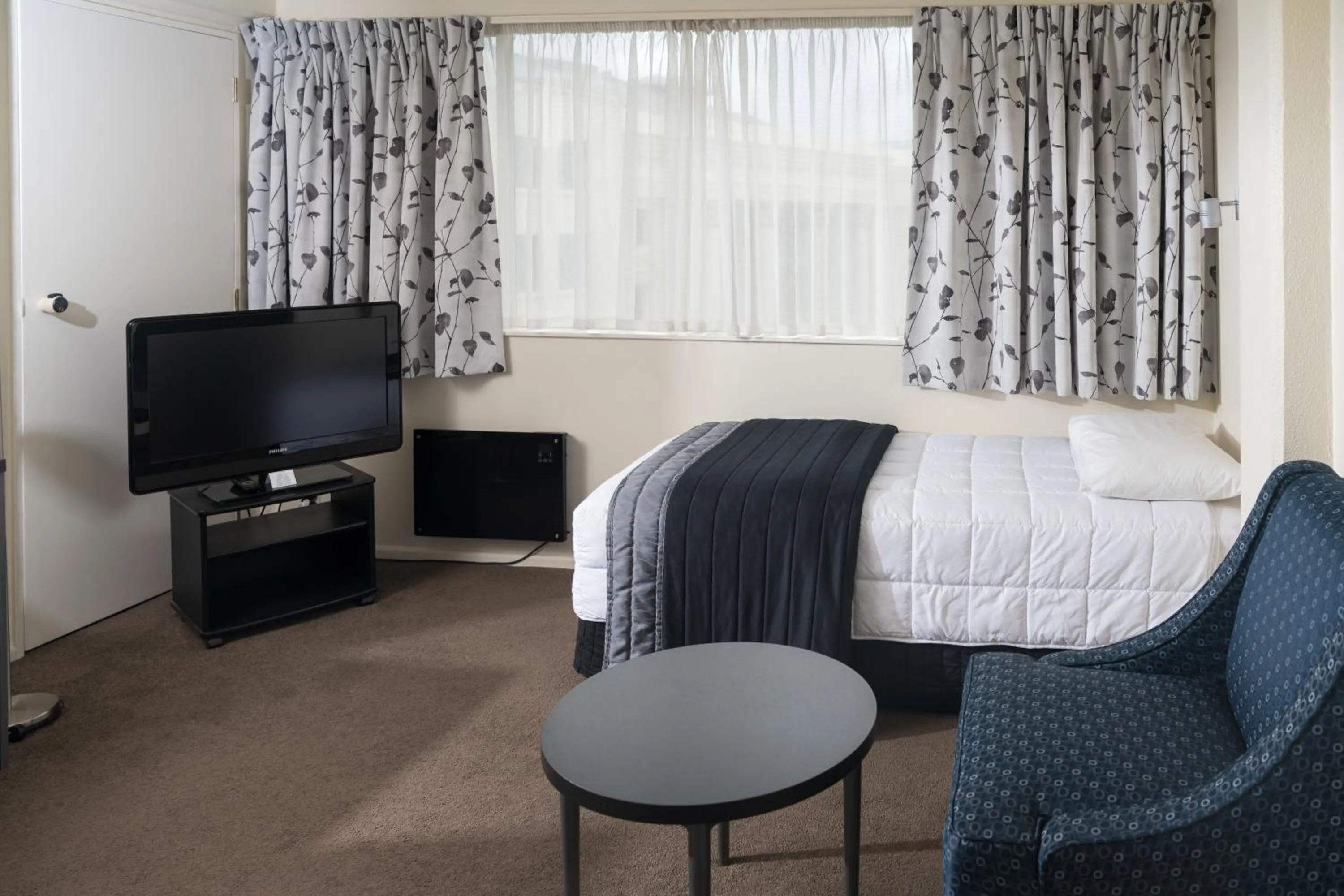 Bed in West Plaza Hotel