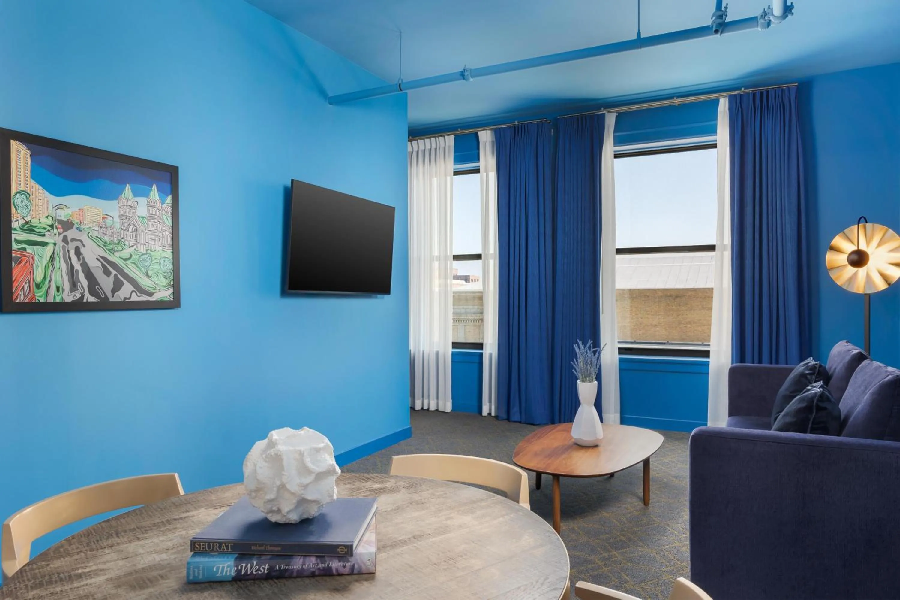 Living room in Angad Arts Hotel St Louis, Tapestry Collection by Hilton