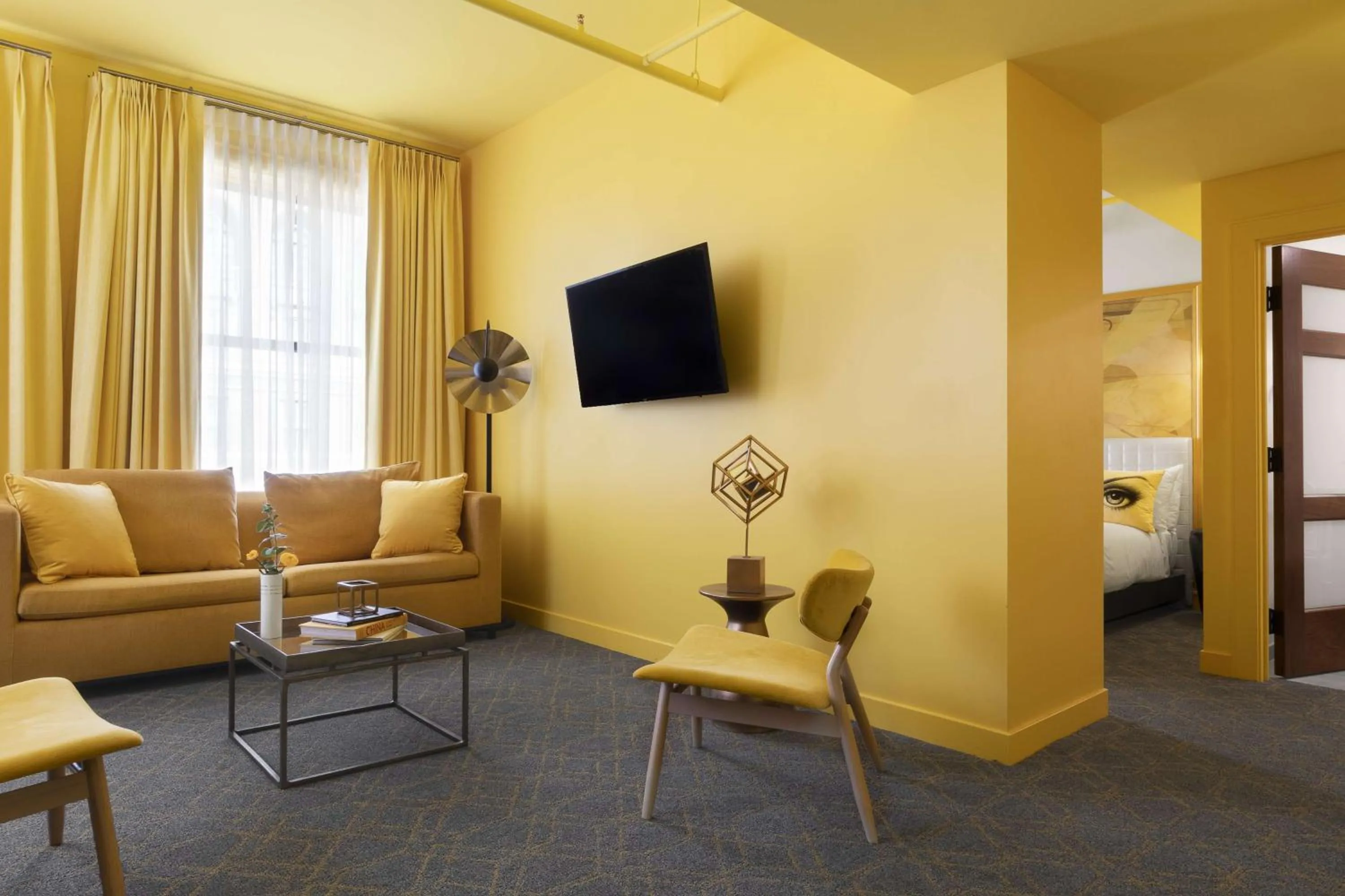 Living room in Angad Arts Hotel St Louis, Tapestry Collection by Hilton