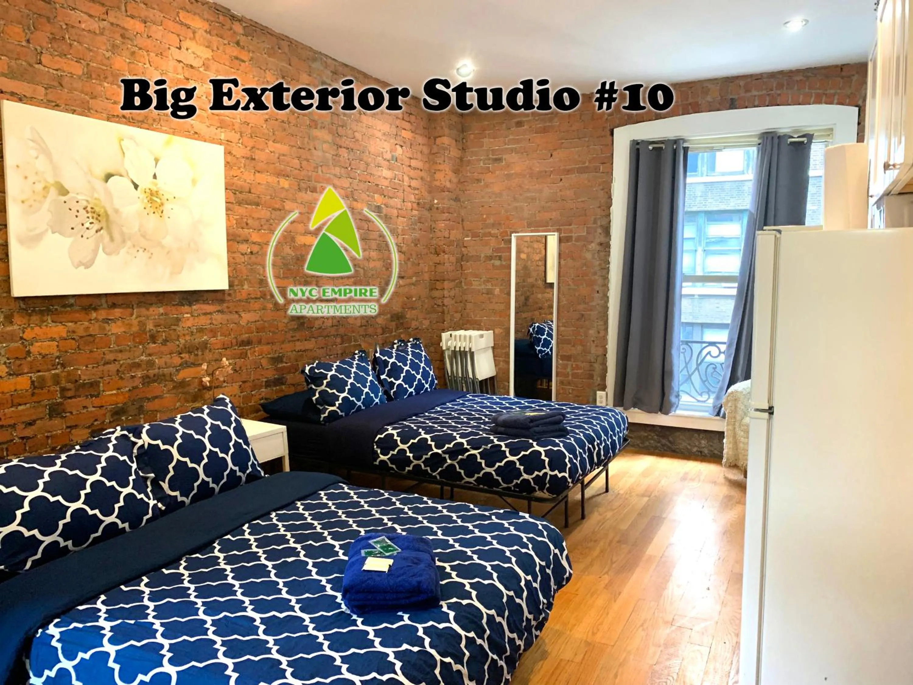 Photo of the whole room, Bed in NYC Empire Apartments