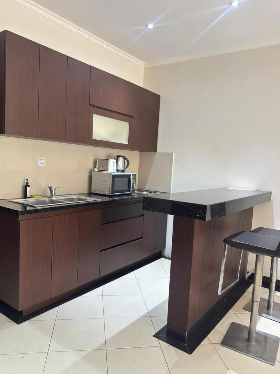 Kitchen or kitchenette in Kuta Town House Apartments