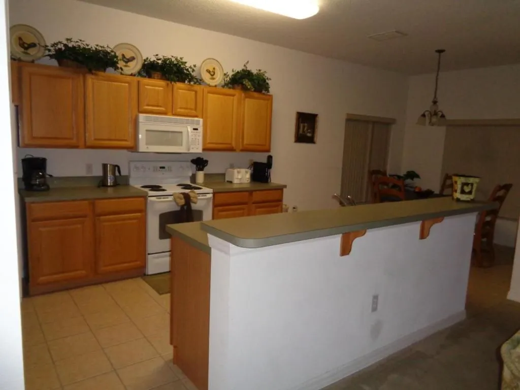 Kitchen or kitchenette in Private Pool Homes