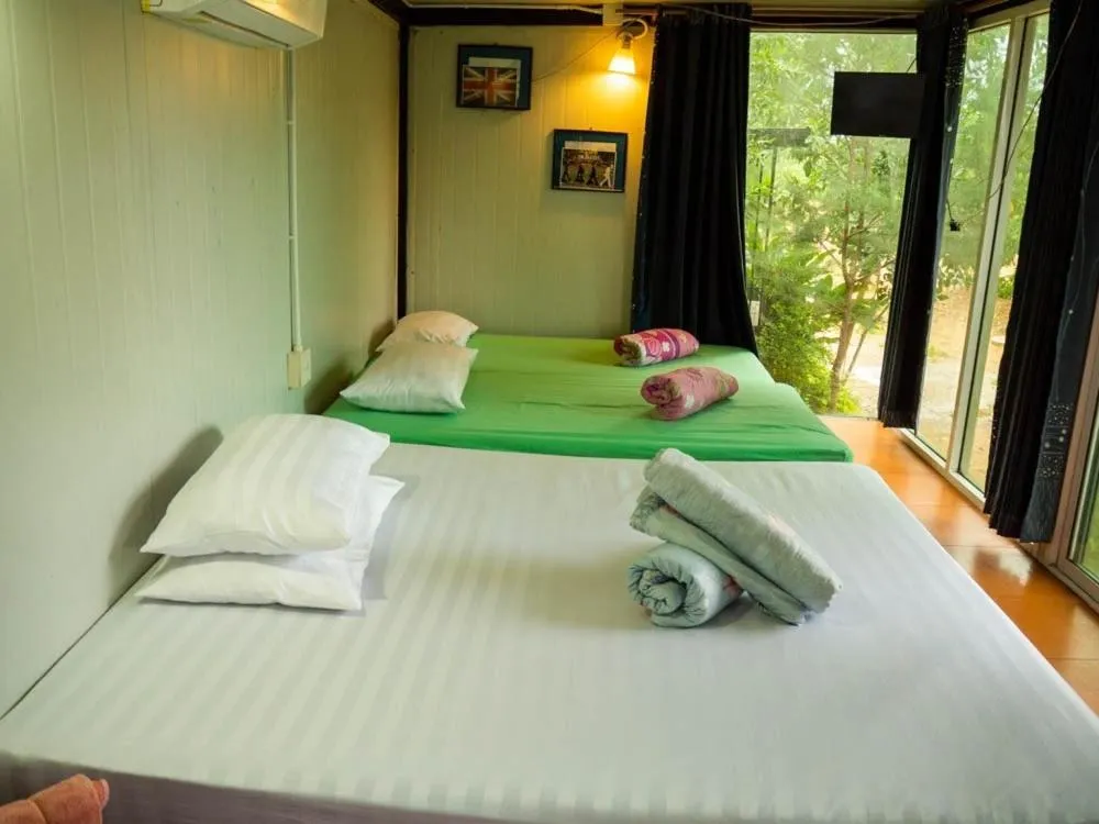 Bed in Beach Box Resort at Rimlay Rayong