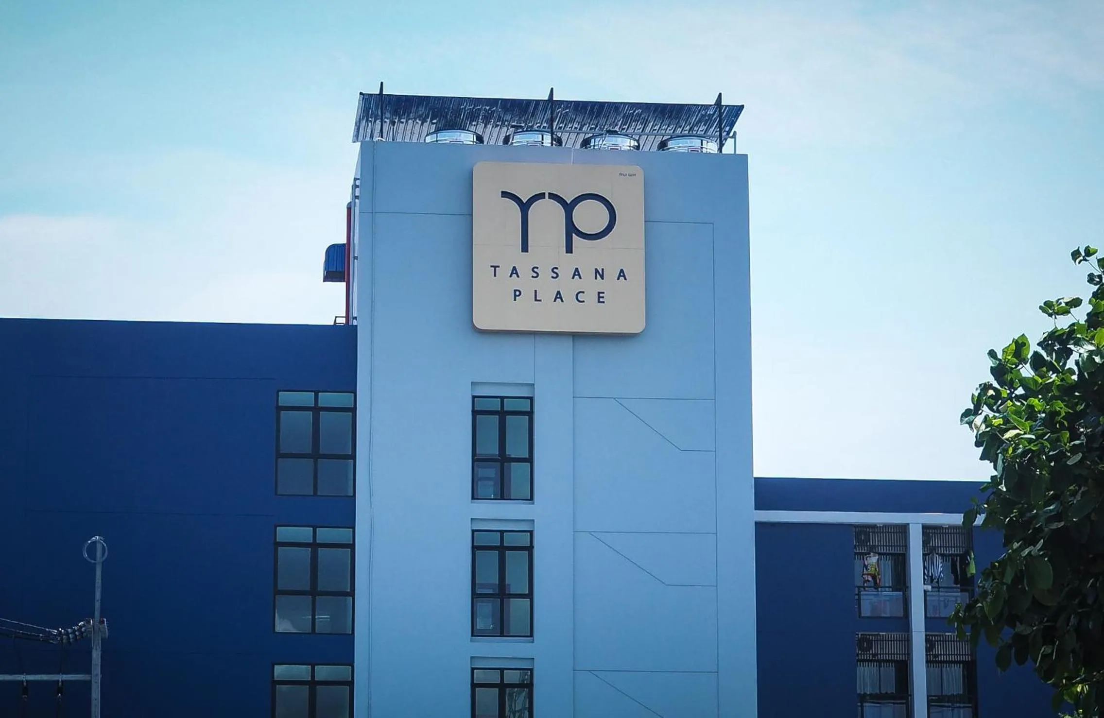 Property logo or sign in Tassana Place