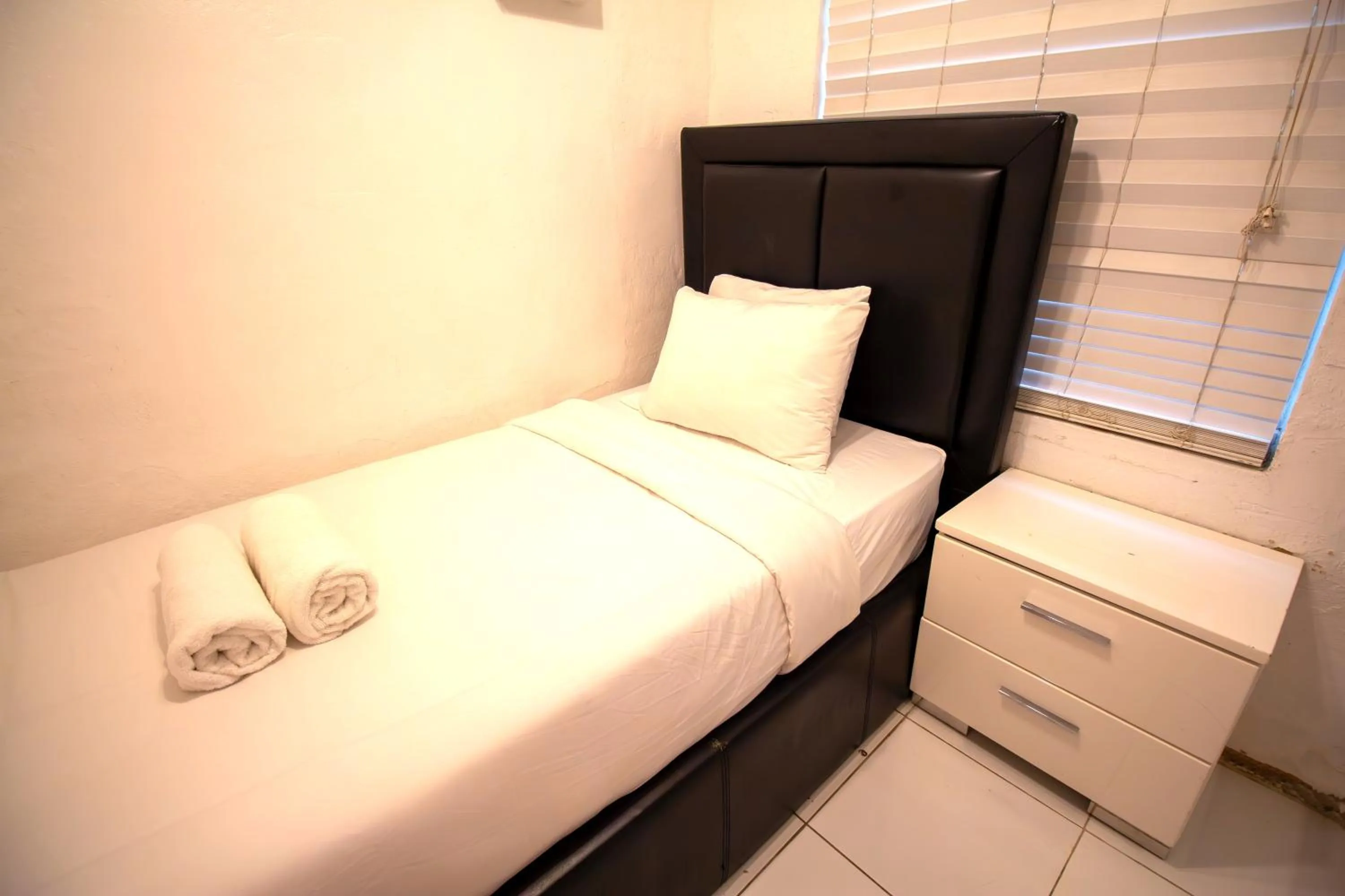 Bed in L'Etoile Apartments Part of the Oasis Casita Collection