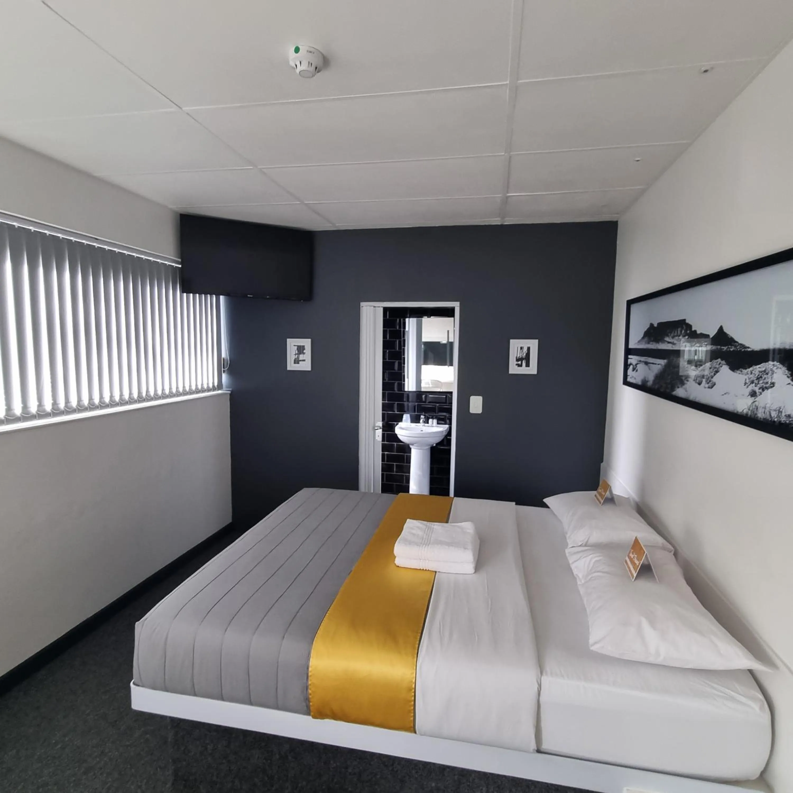 Bed in Check Inn Hotel