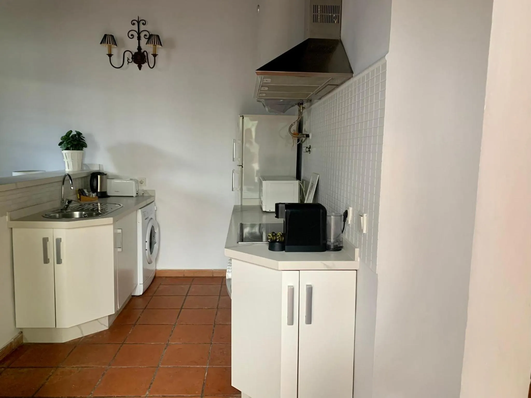 Kitchen or kitchenette in Apartamentos Los Patios de la Judería