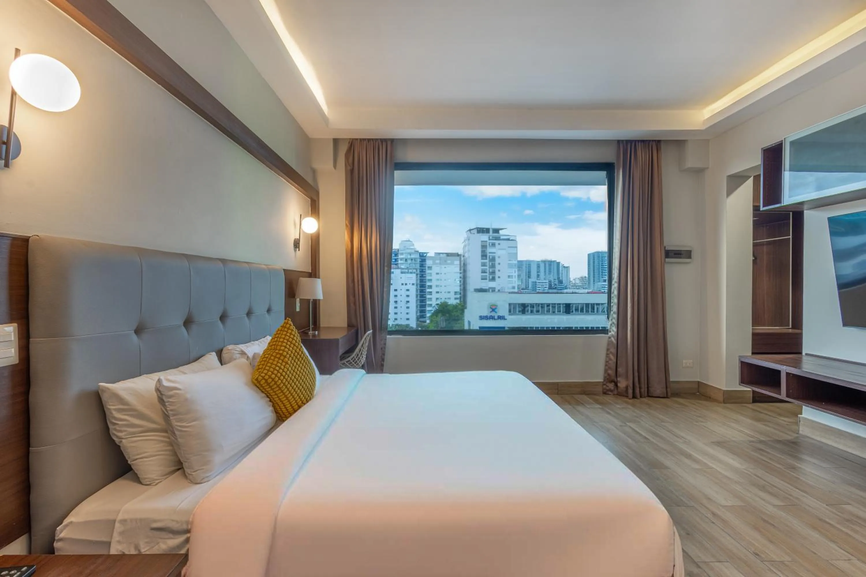 Bed in Weston Suites Hotel