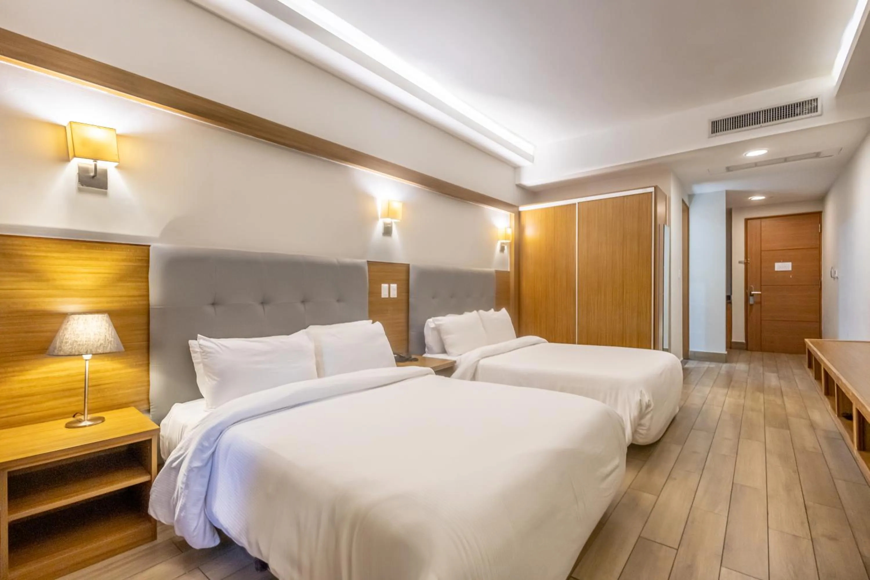 Bed in Weston Suites Hotel