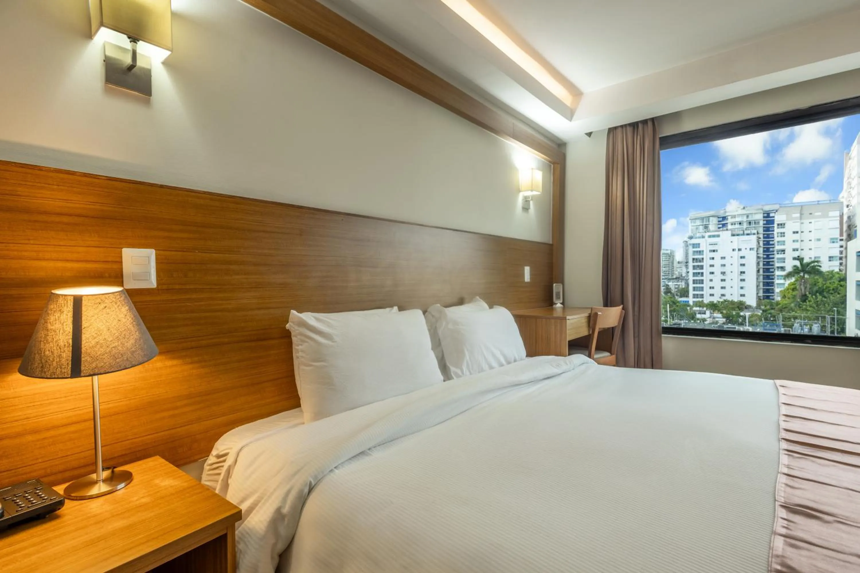 Bed in Weston Suites Hotel