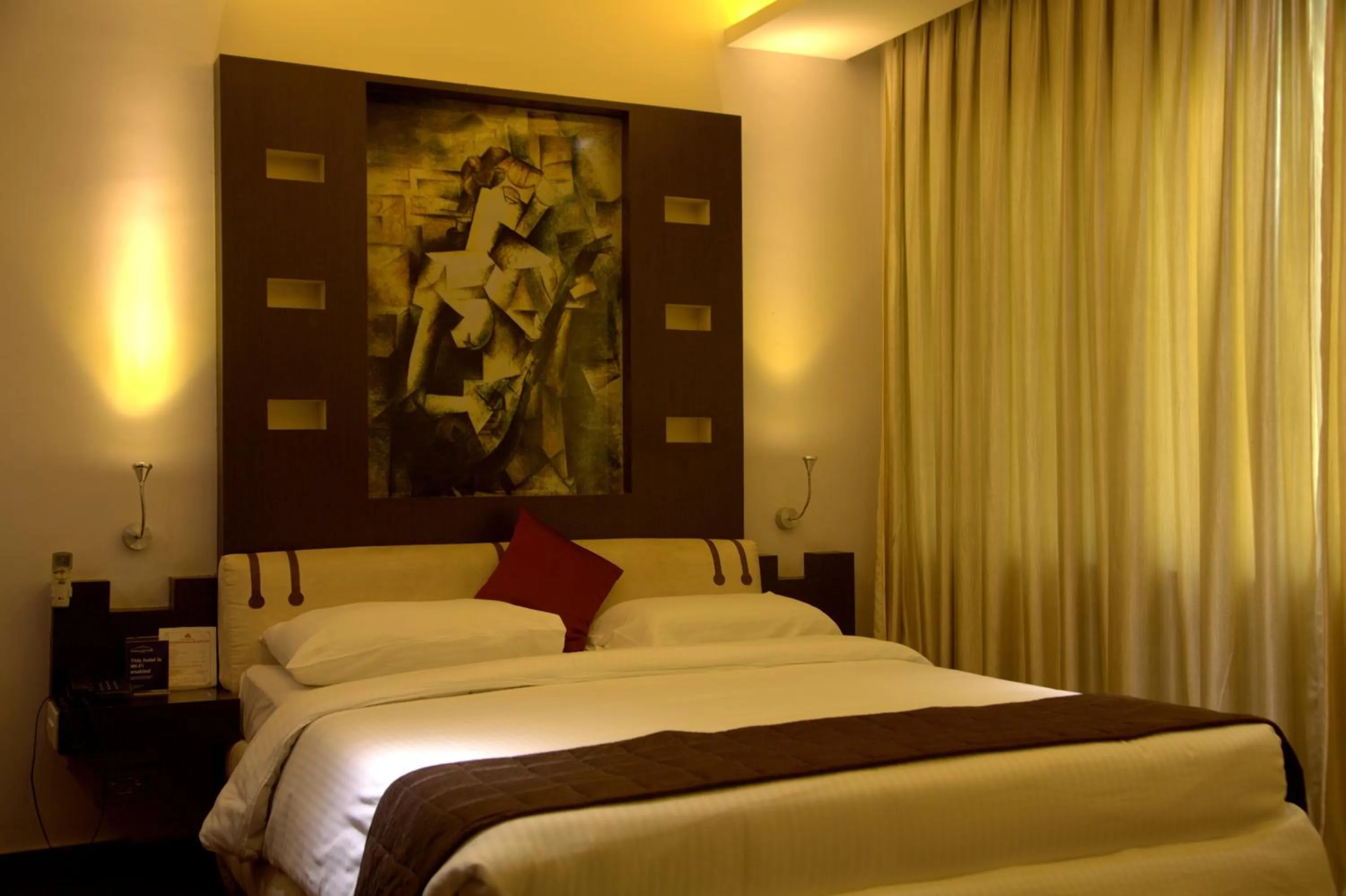 Bed in Hotel Gokulam Park