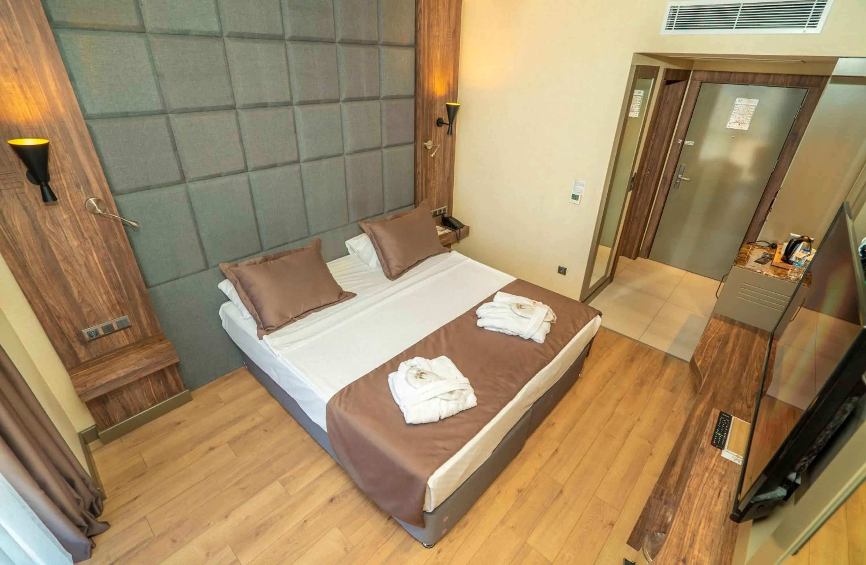 Bed in NEW KARAMAN HOTEL