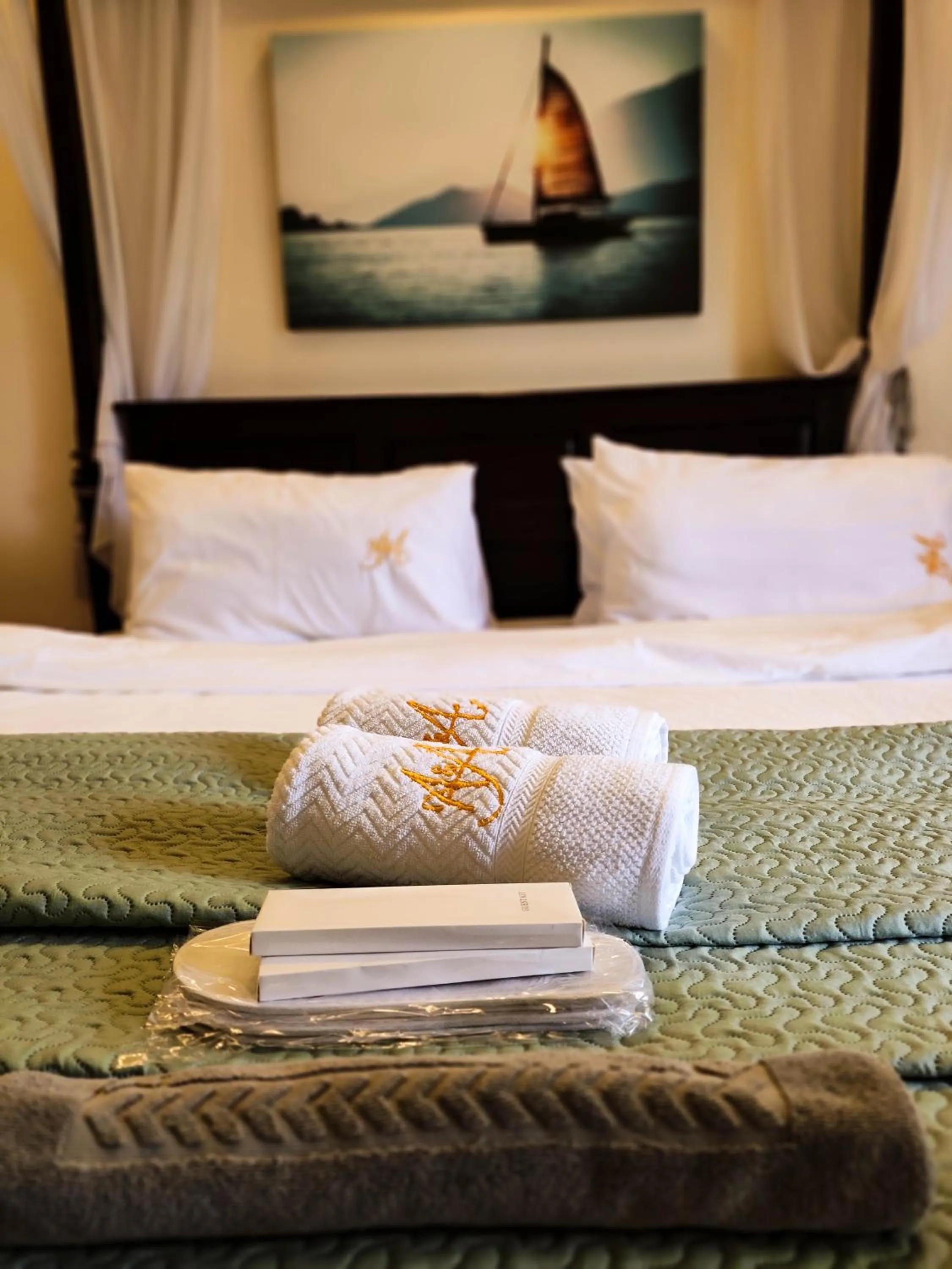 towels, Bed in A&A Garden Suites