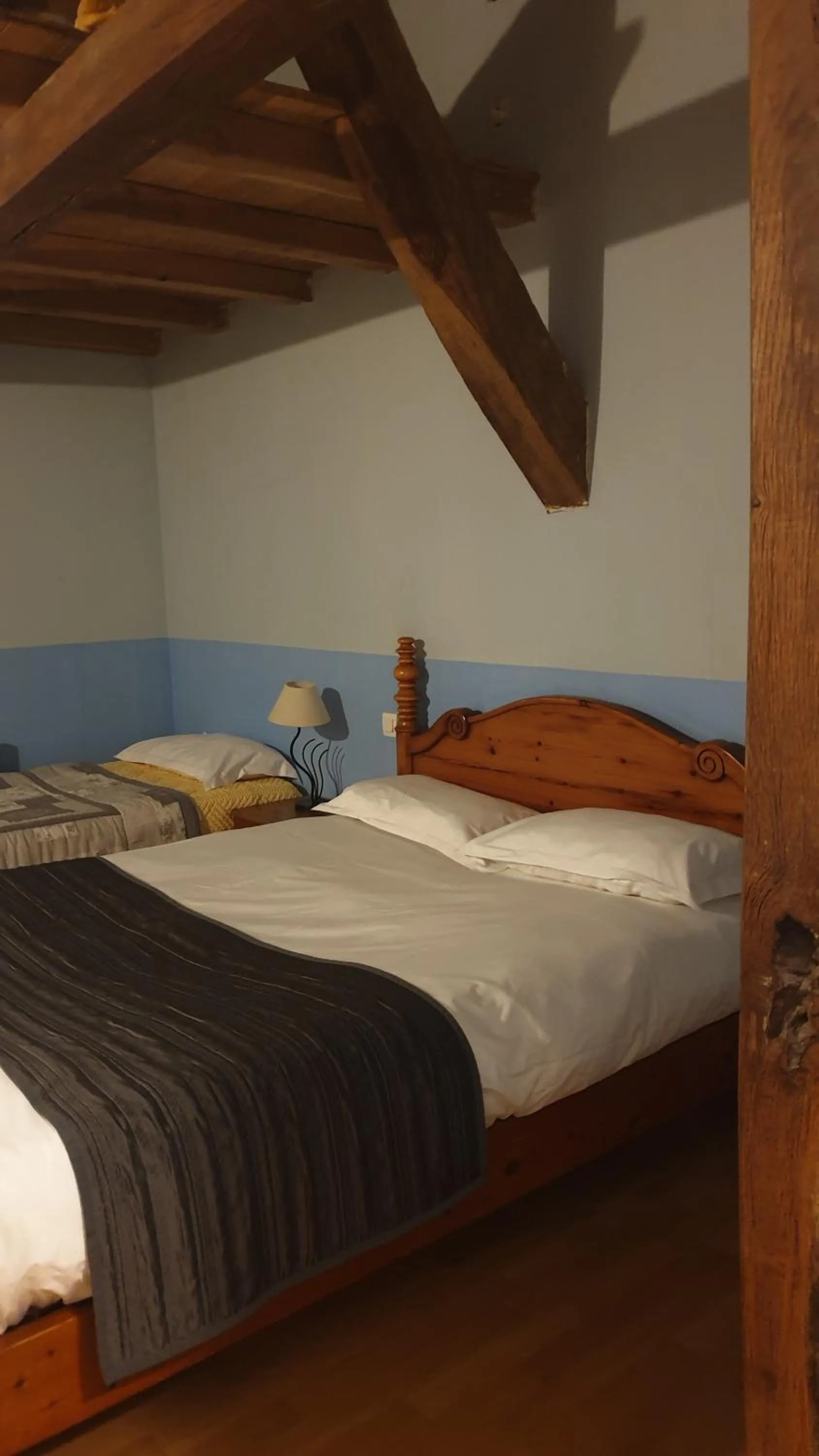 Bed in L'ALCOVE HOTEL RESTAURANT