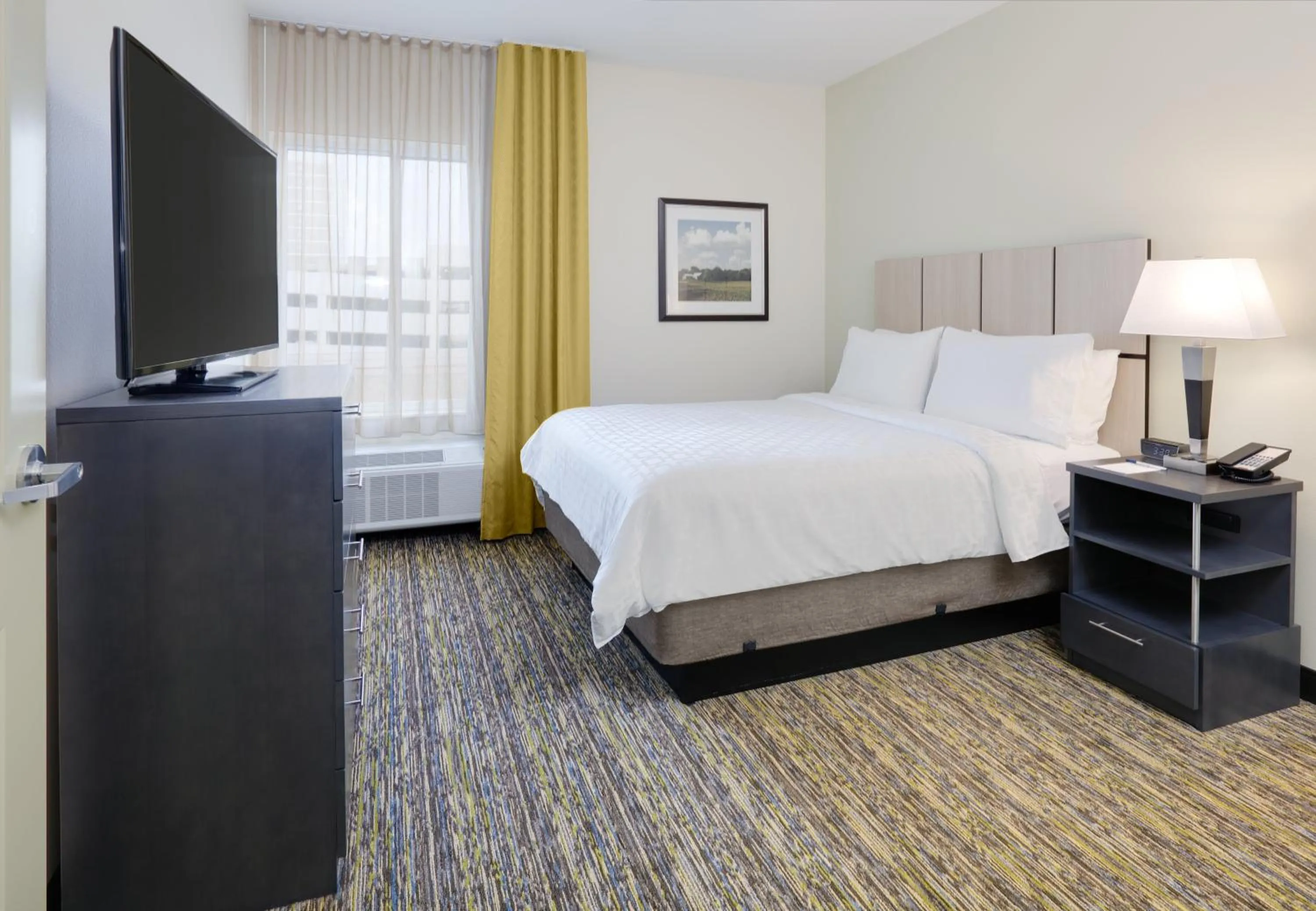 Photo of the whole room, Bed in Candlewood Suites Dallas NW - Farmers Branch by IHG