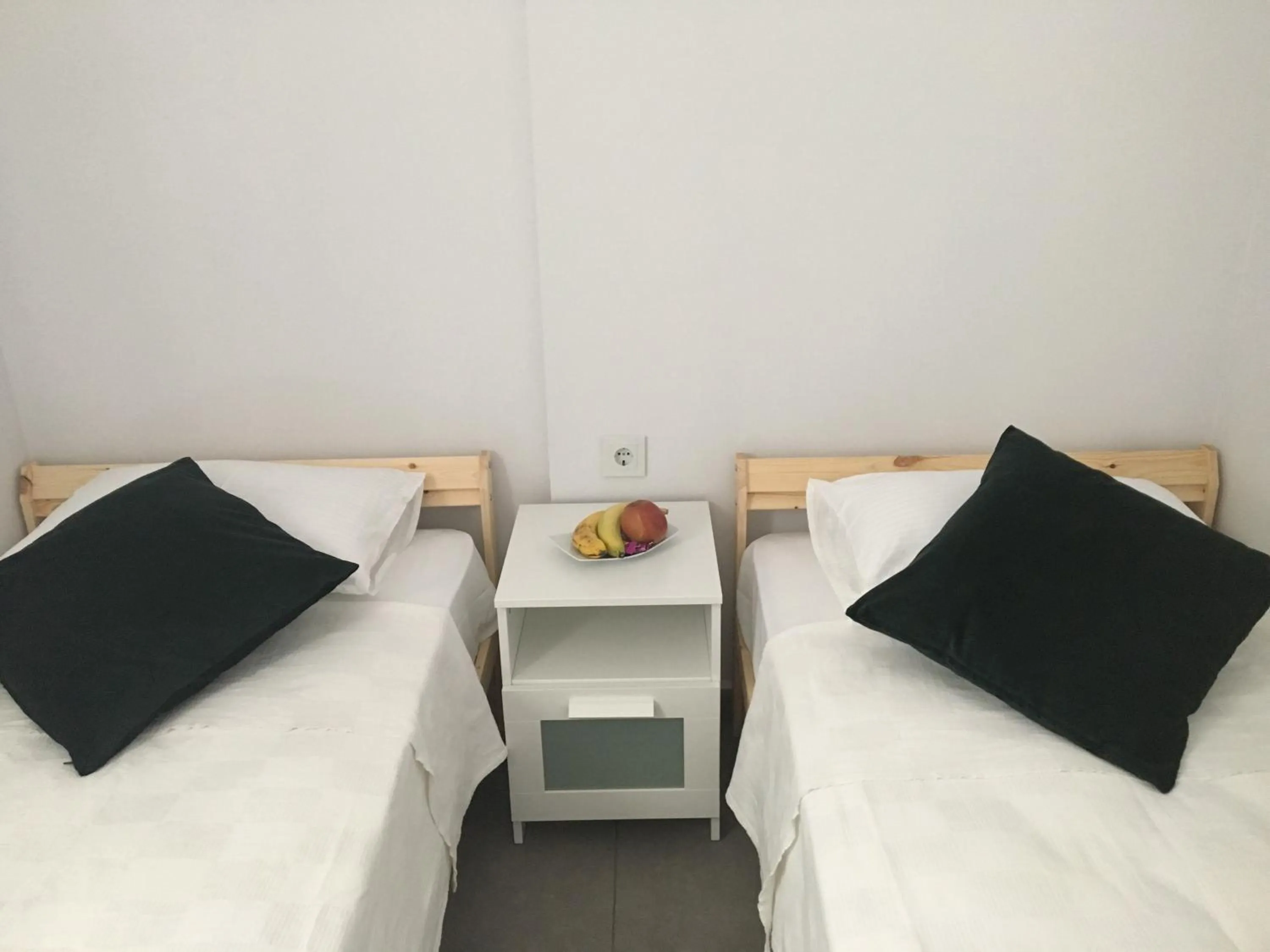 Bed in Truemar Hotels & Suites