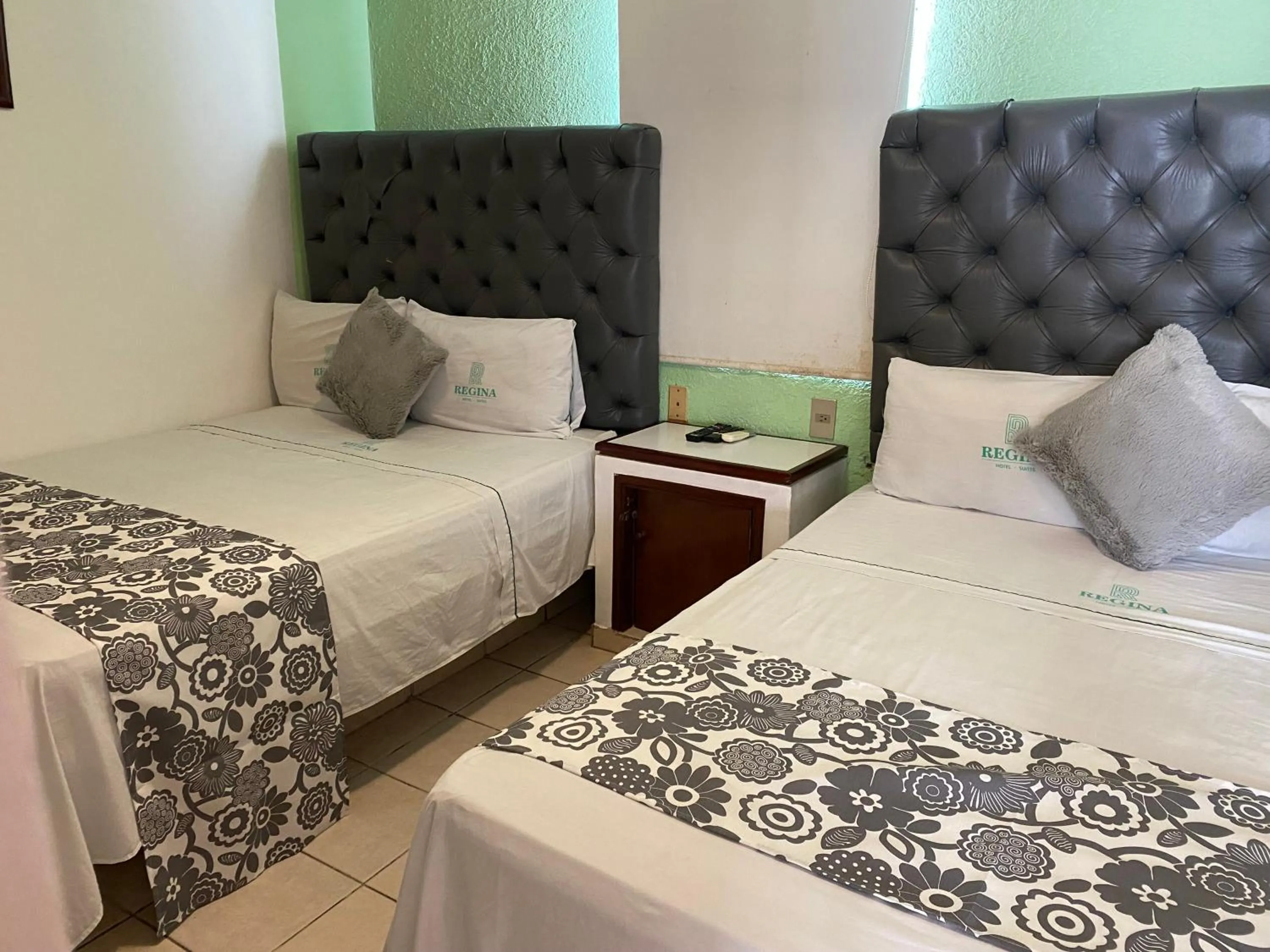 Bed in Hotel Suites Regina