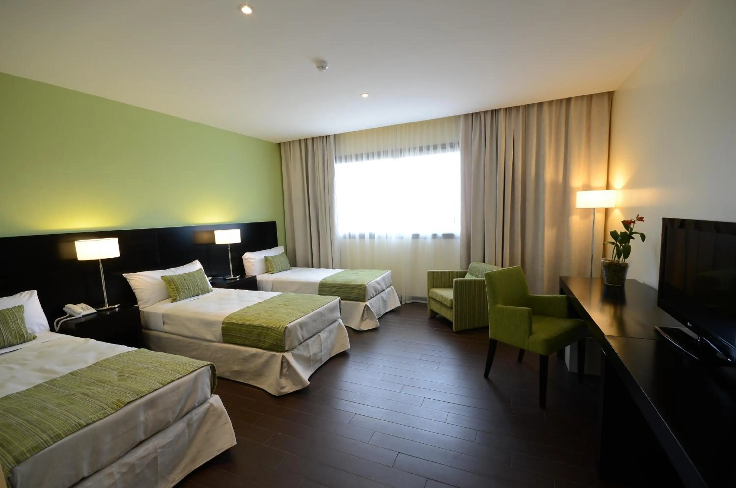 Bed in Grand Crucero Hotel