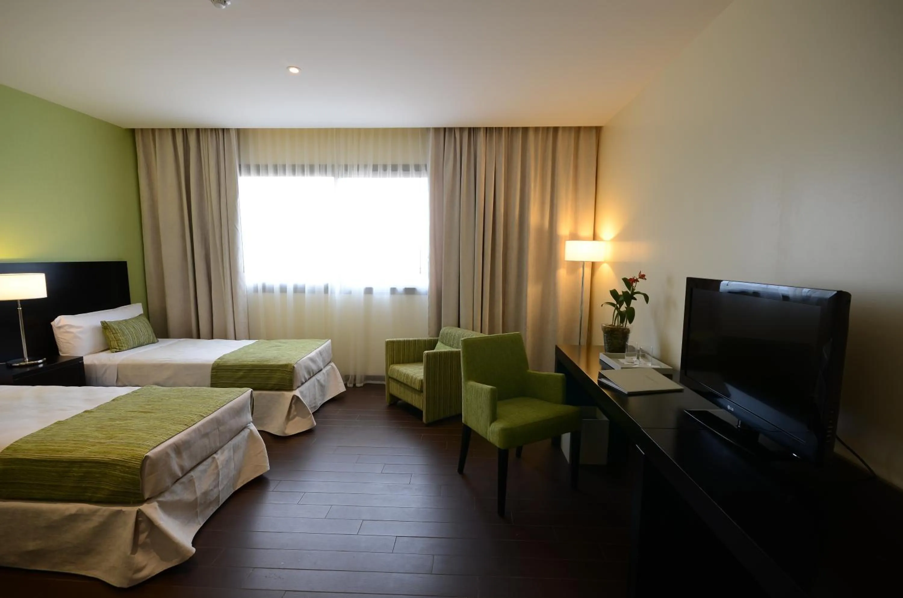 Bed in Grand Crucero Hotel